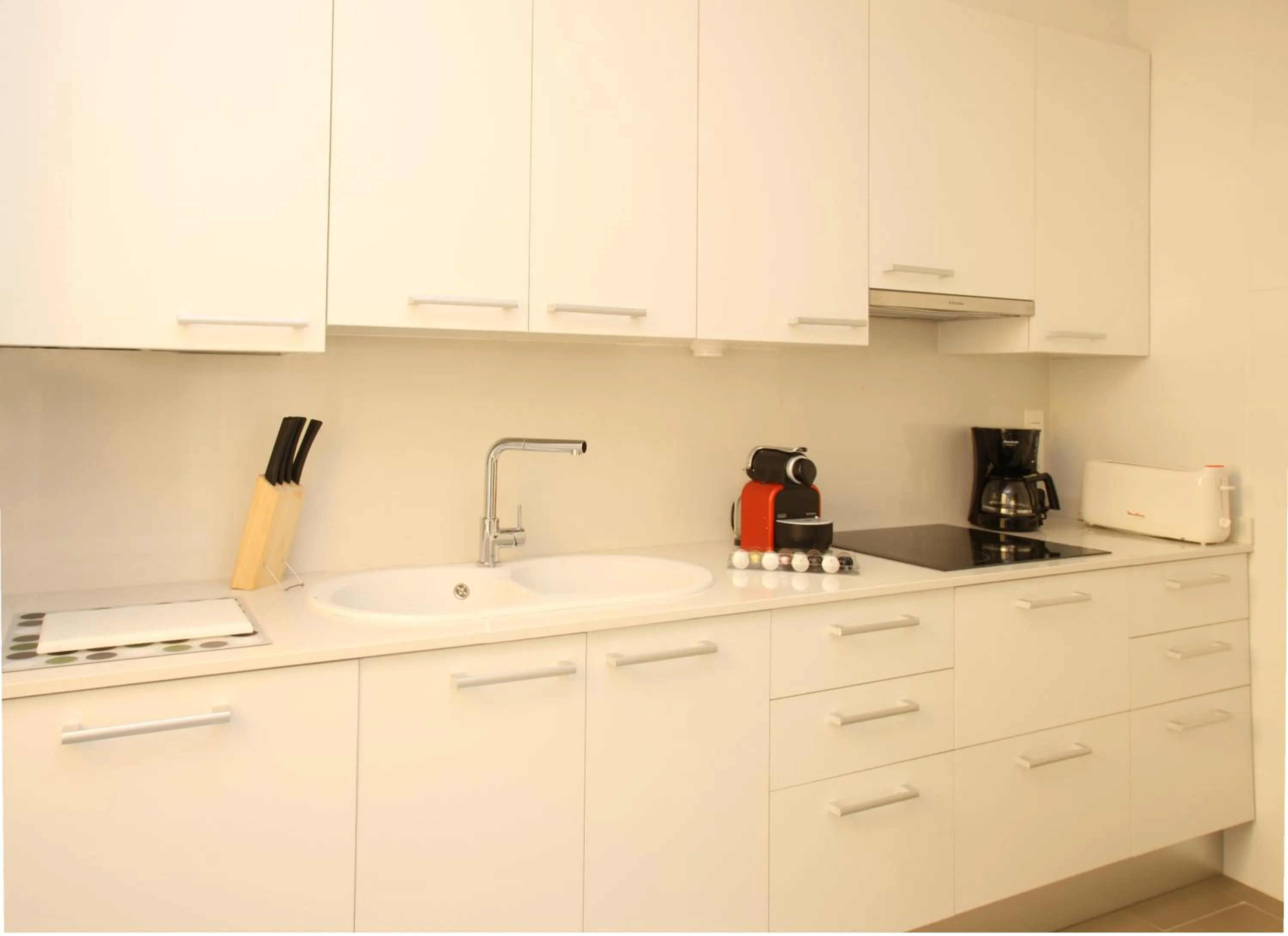 Kitchen or kitchenette in MH Apartments Suites