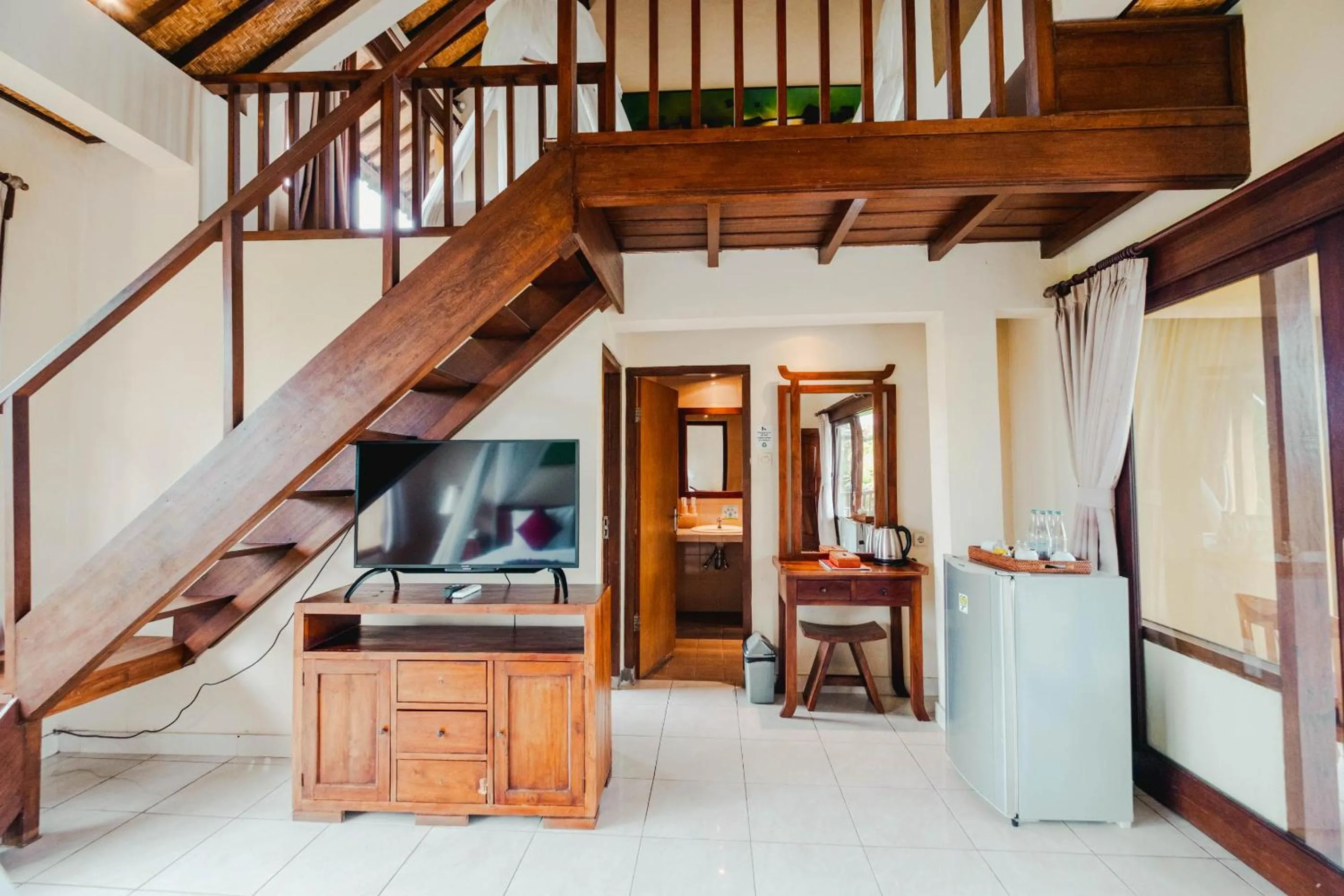 Communal lounge/ TV room in Sri Aksata Ubud Resort