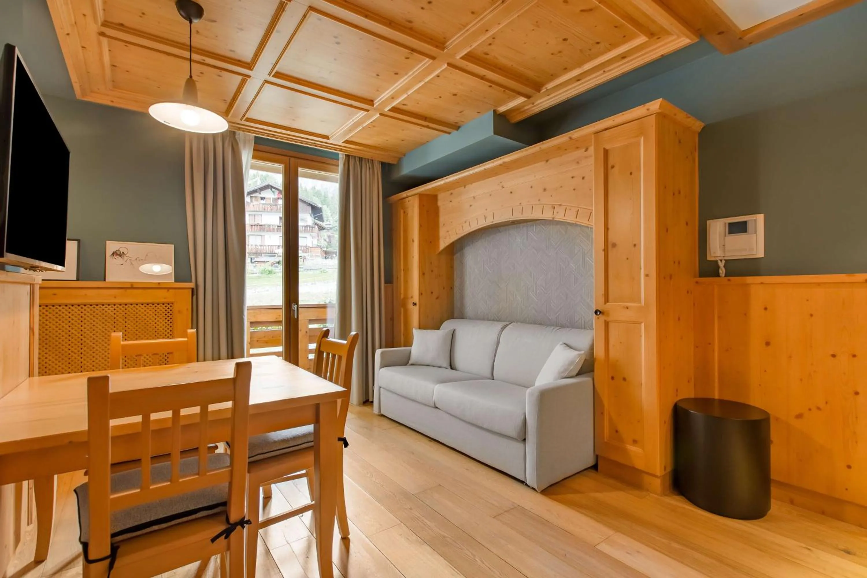 Photo of the whole room in Radisson Residences Savoia Palace Cortina d’Ampezzo