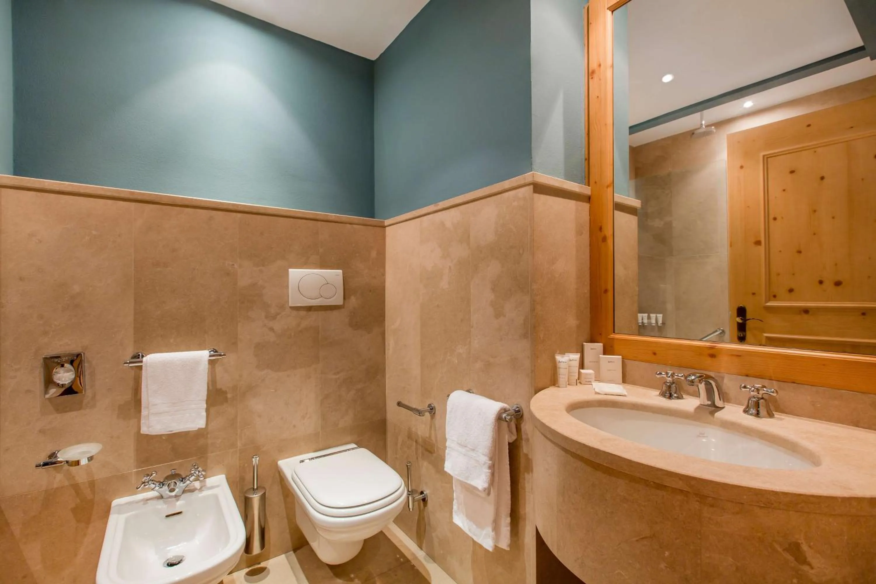 Photo of the whole room in Radisson Residences Savoia Palace Cortina d’Ampezzo