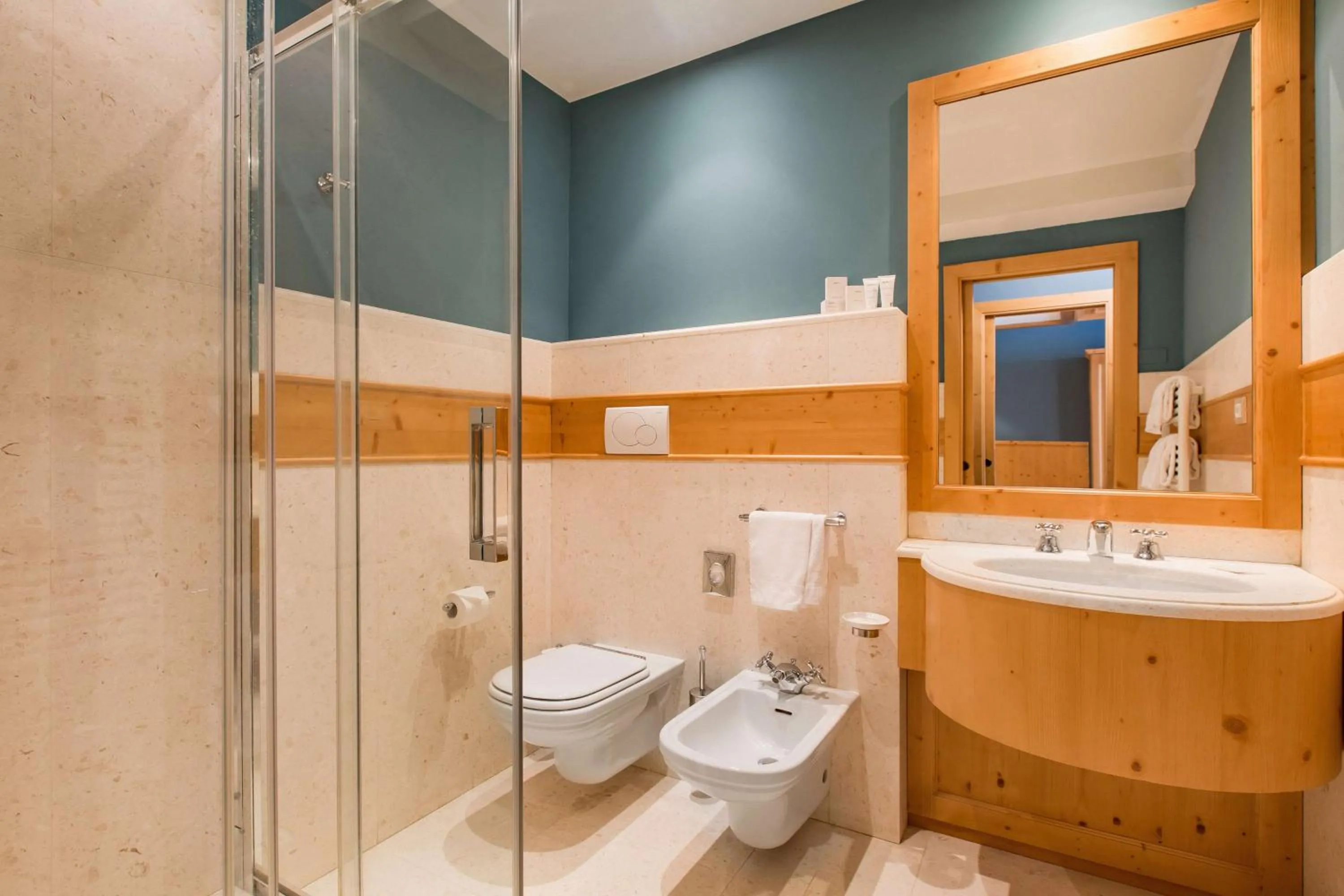 Photo of the whole room in Radisson Residences Savoia Palace Cortina d’Ampezzo