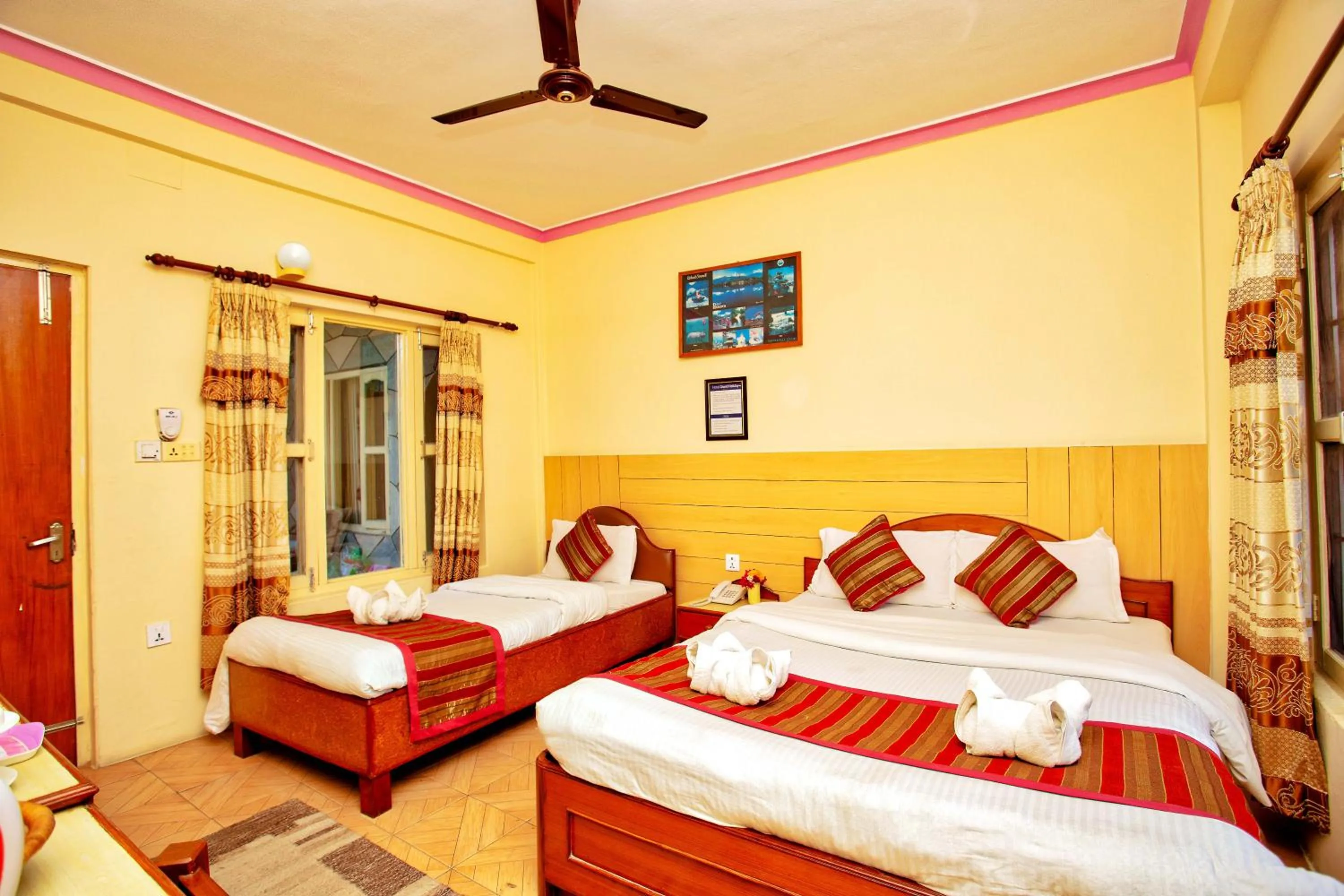 Bed in Hotel Grand Holiday