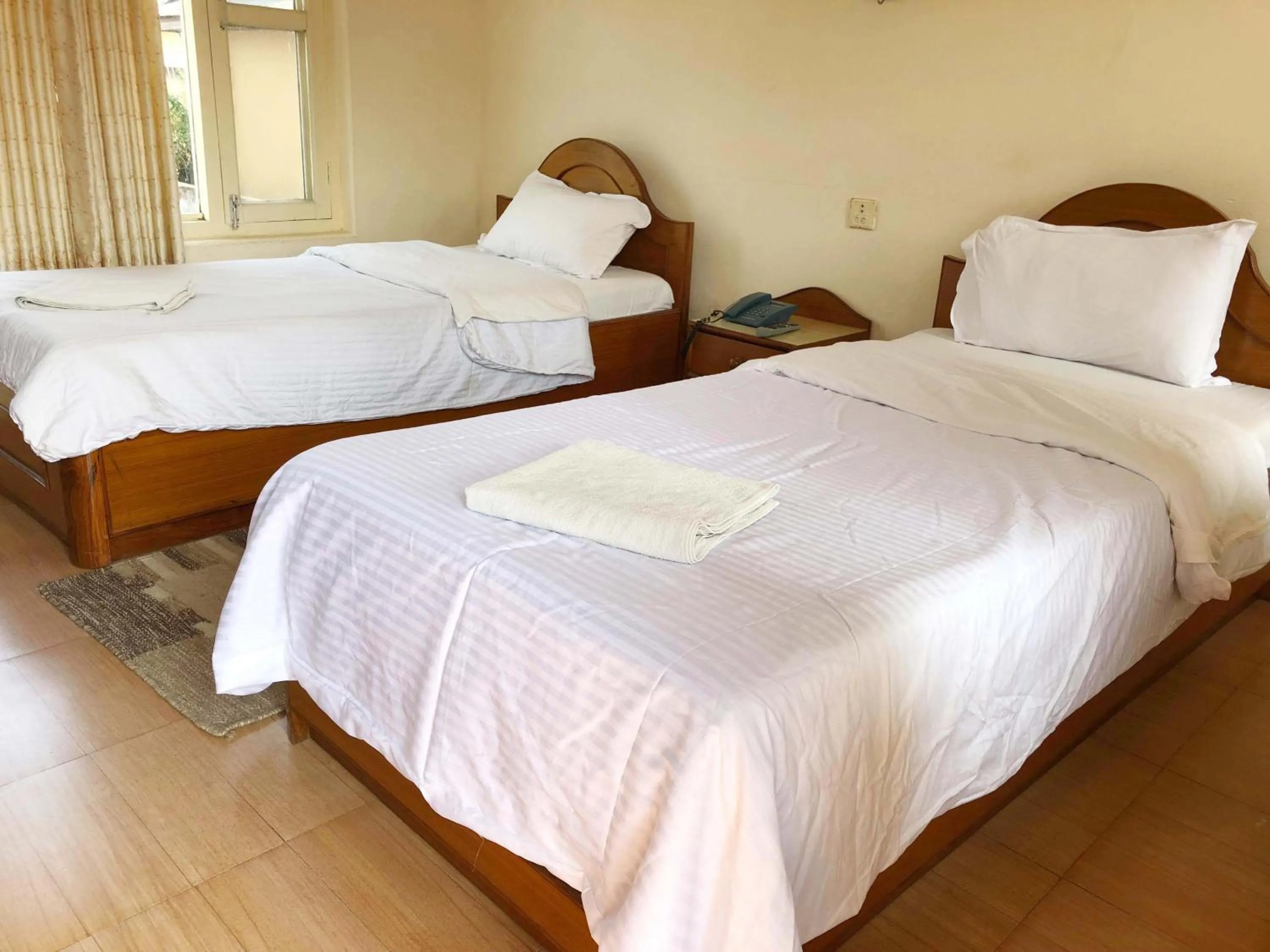 Bed in Hotel Grand Holiday