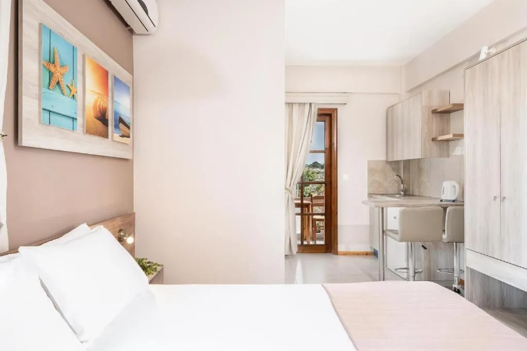 Kitchen or kitchenette, Bed in Cathrin Suites