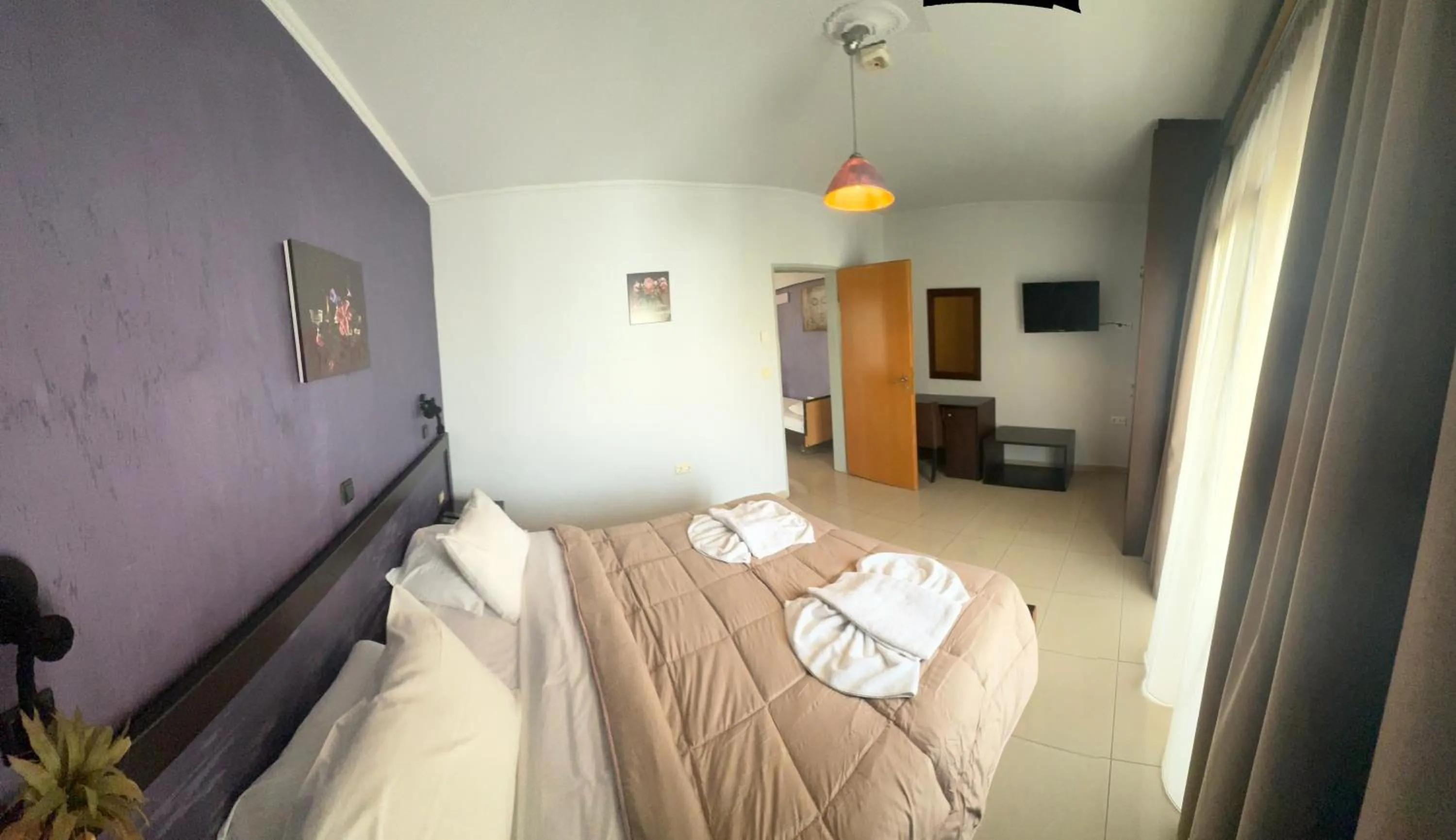 Bed in Comfort Hotel Apartments