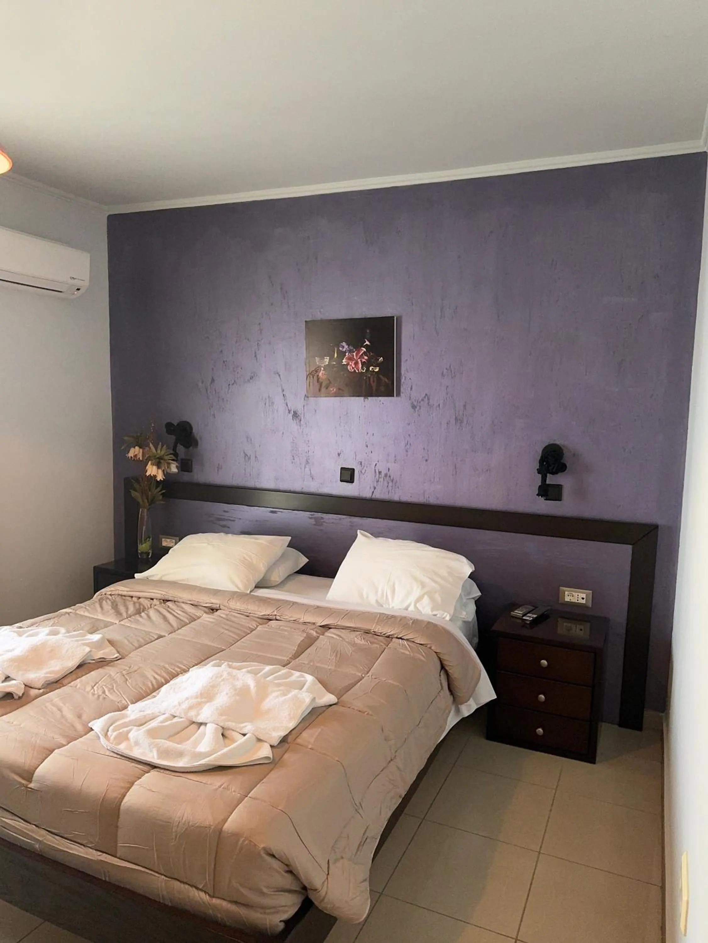 Bed in Comfort Hotel Apartments