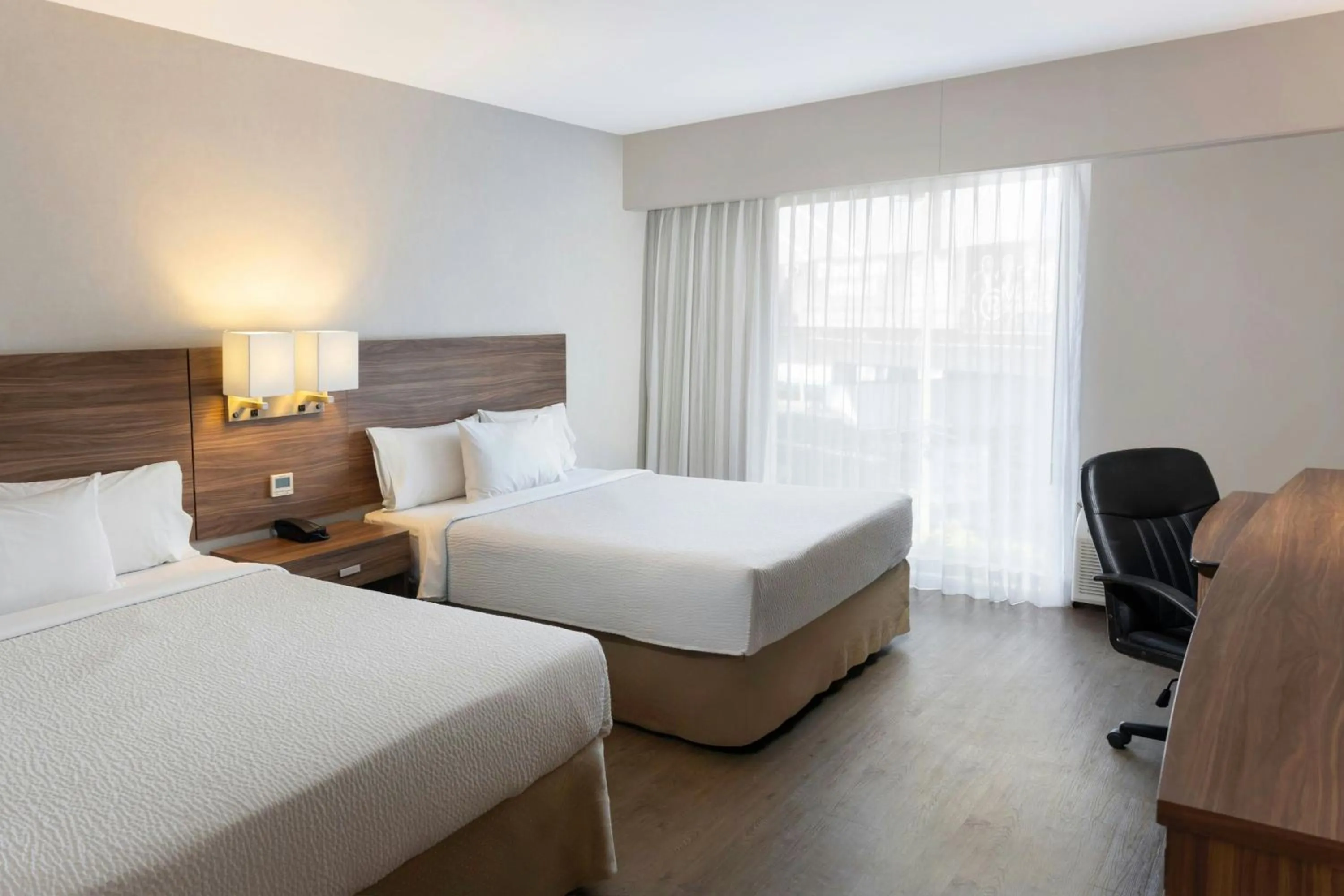 Photo of the whole room, Bed in Courtyard by Marriott Puebla Las Animas