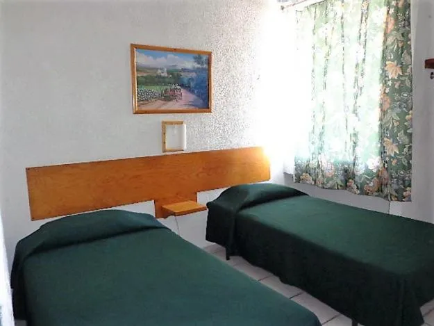 Bed in Hotel Vagabundo Puerto Vallarta