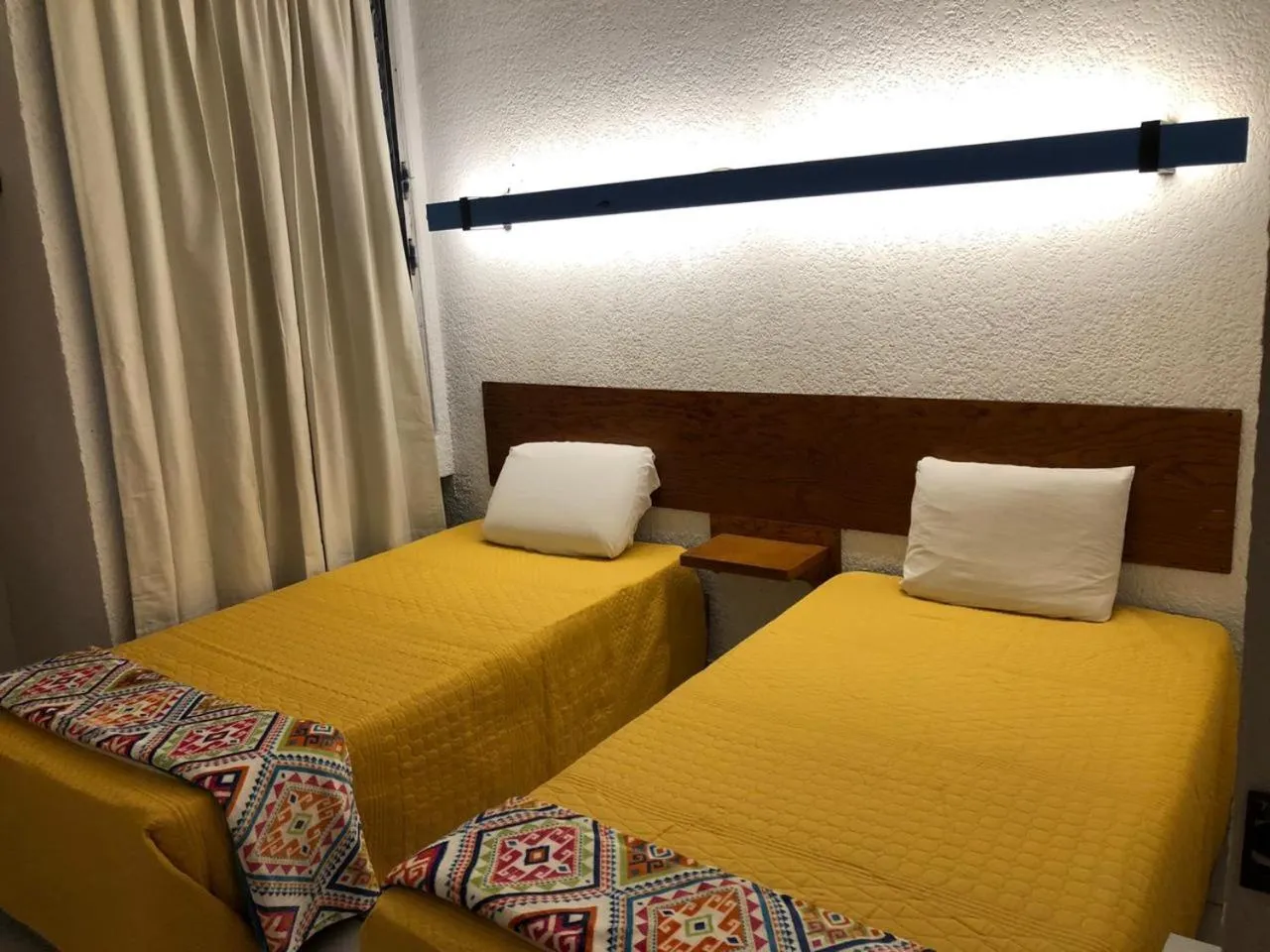 Bed in Hotel Vagabundo Puerto Vallarta