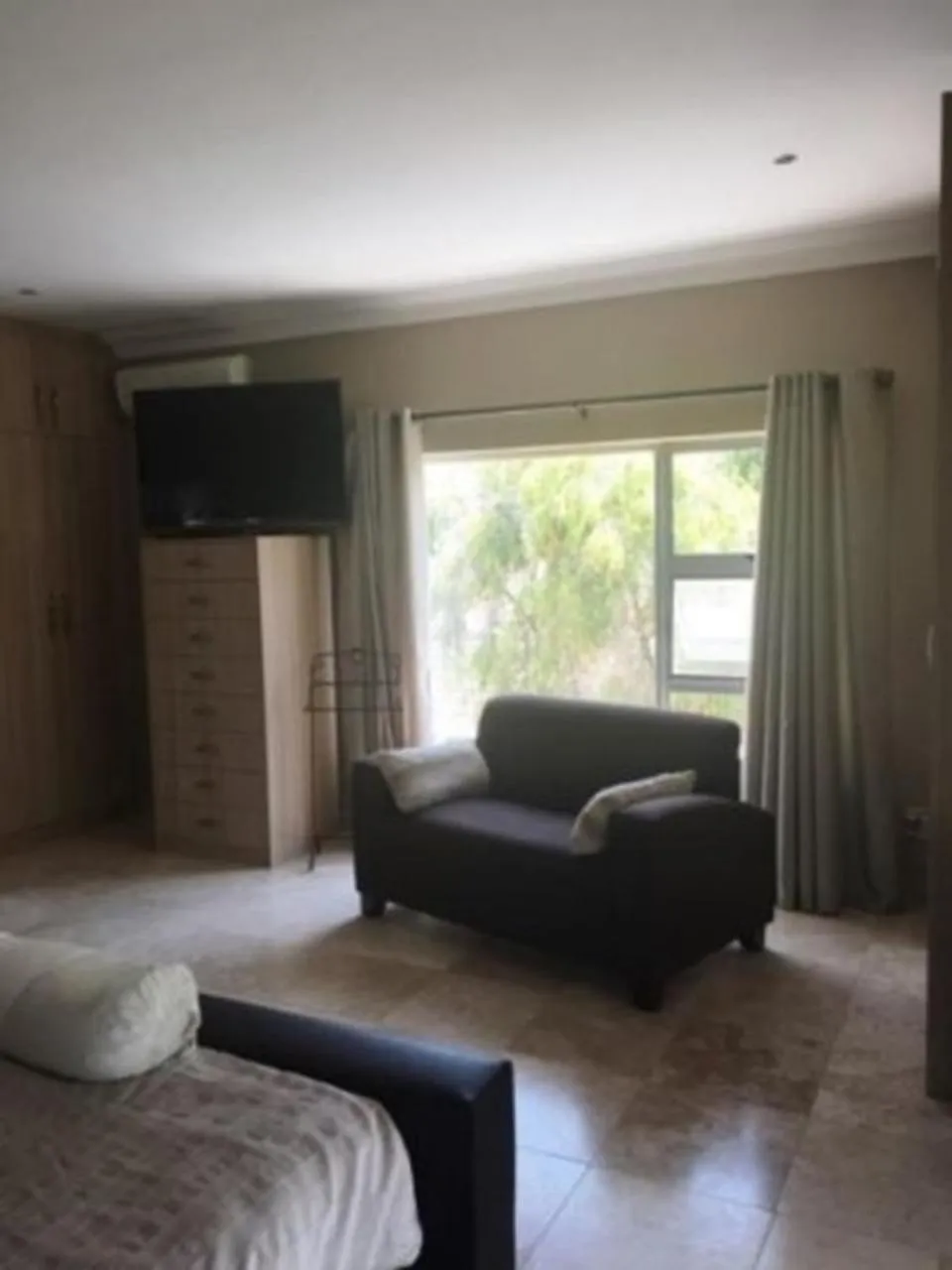 Bedroom in African Palm Cottage and Guesthouse