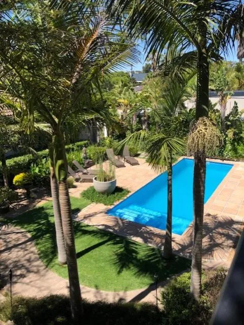 Swimming pool in African Palm Cottage and Guesthouse