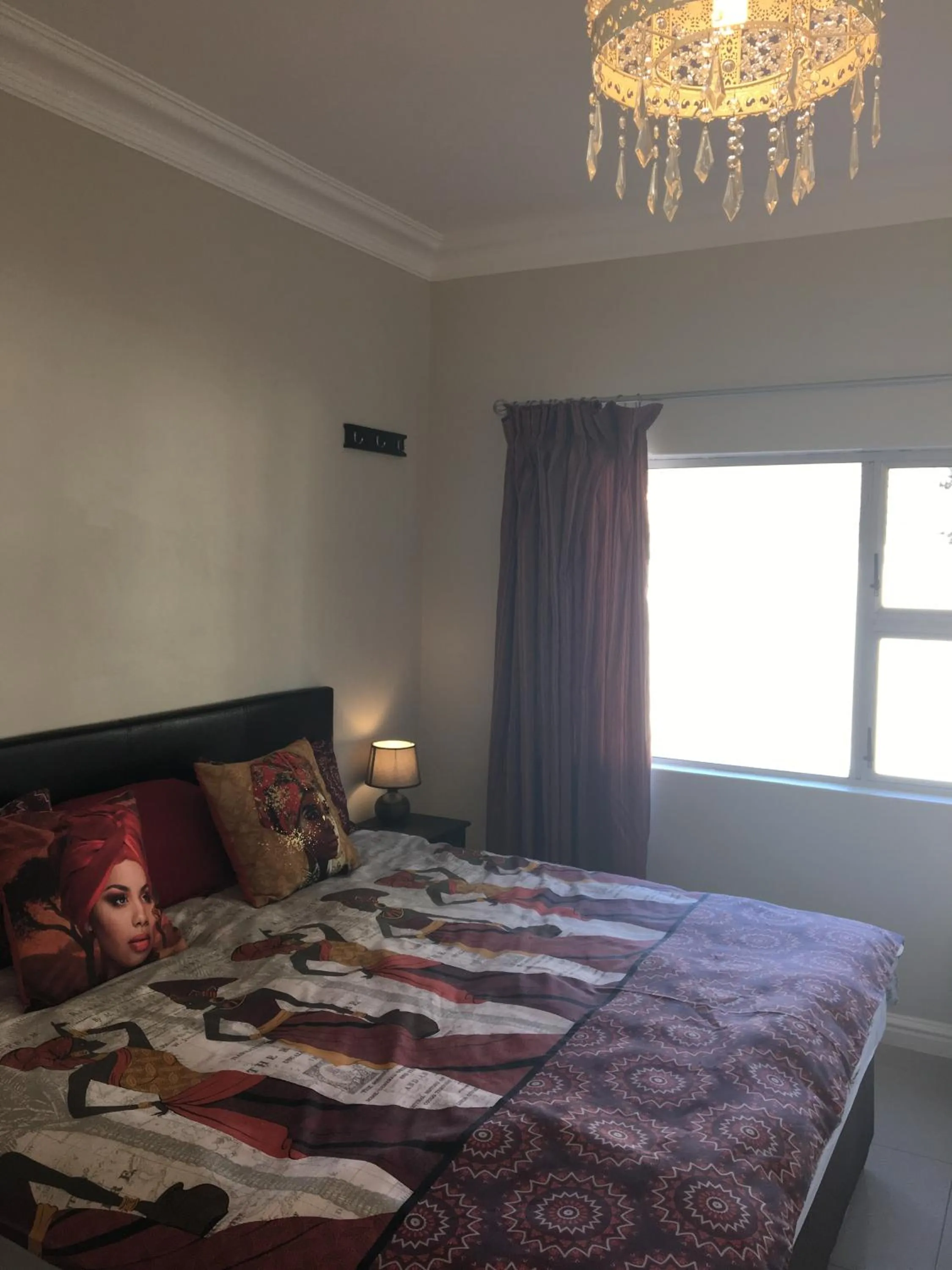 Bedroom in African Palm Cottage and Guesthouse