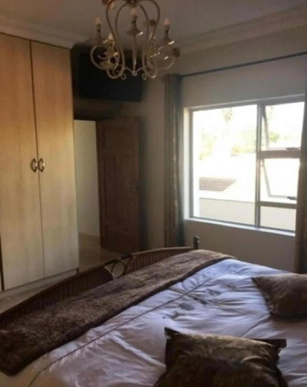 Bedroom in African Palm Cottage and Guesthouse