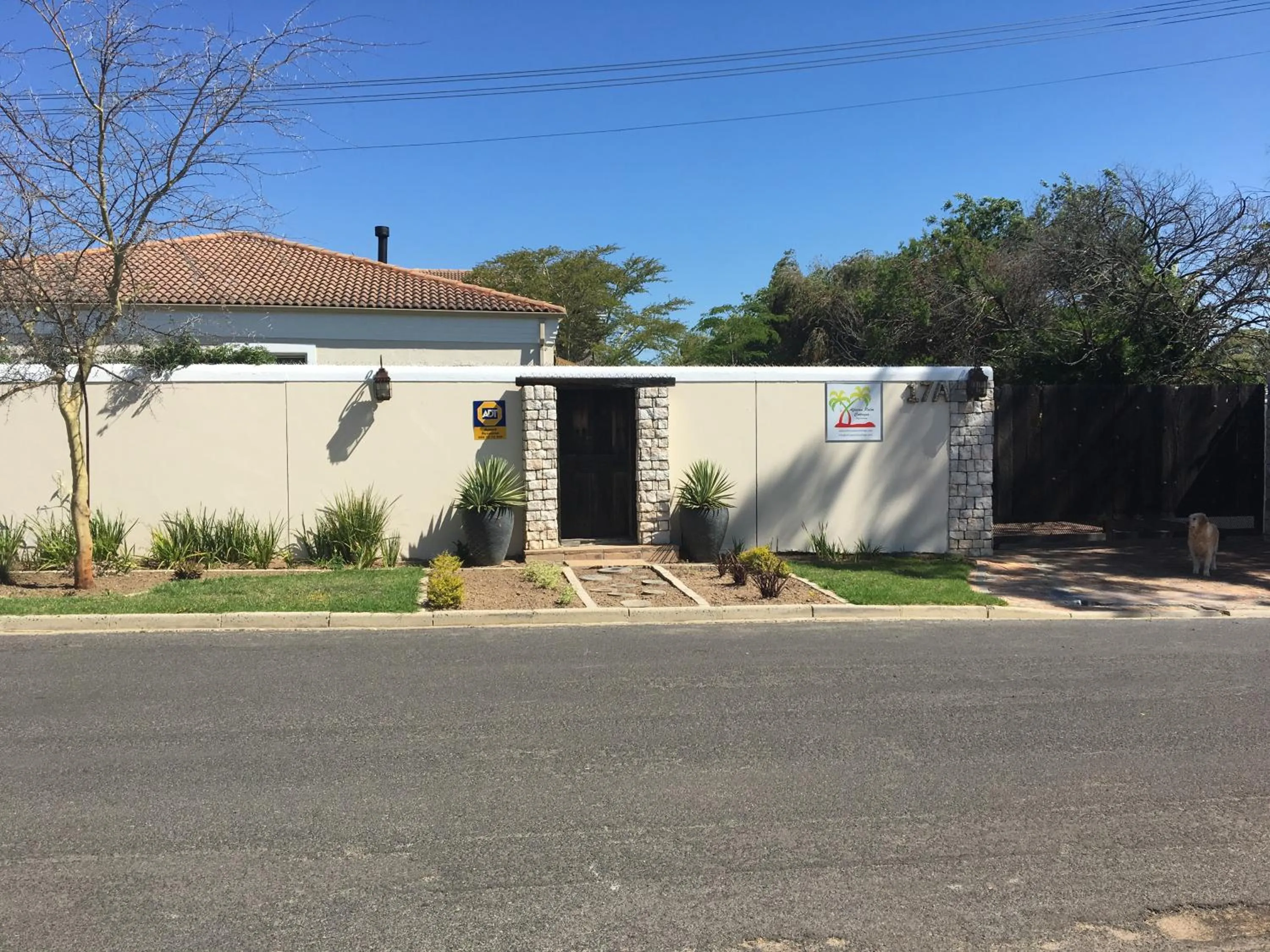 Facade/entrance in African Palm Cottage and Guesthouse