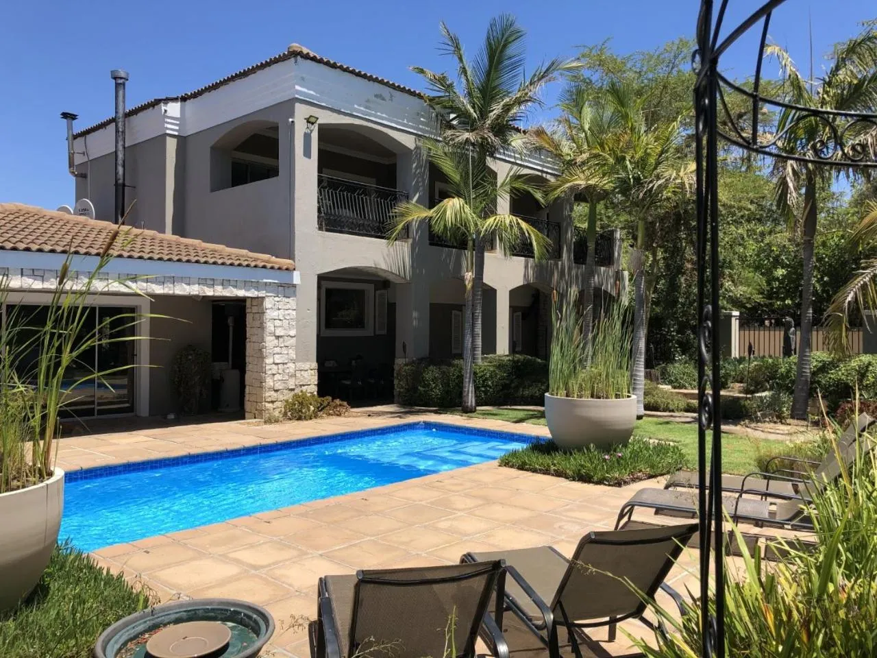 Swimming pool in African Palm Cottage and Guesthouse