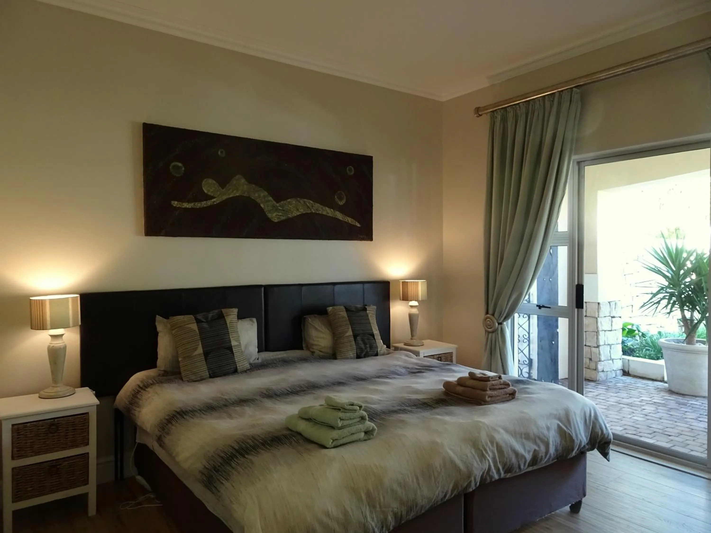 Bedroom in African Palm Cottage and Guesthouse