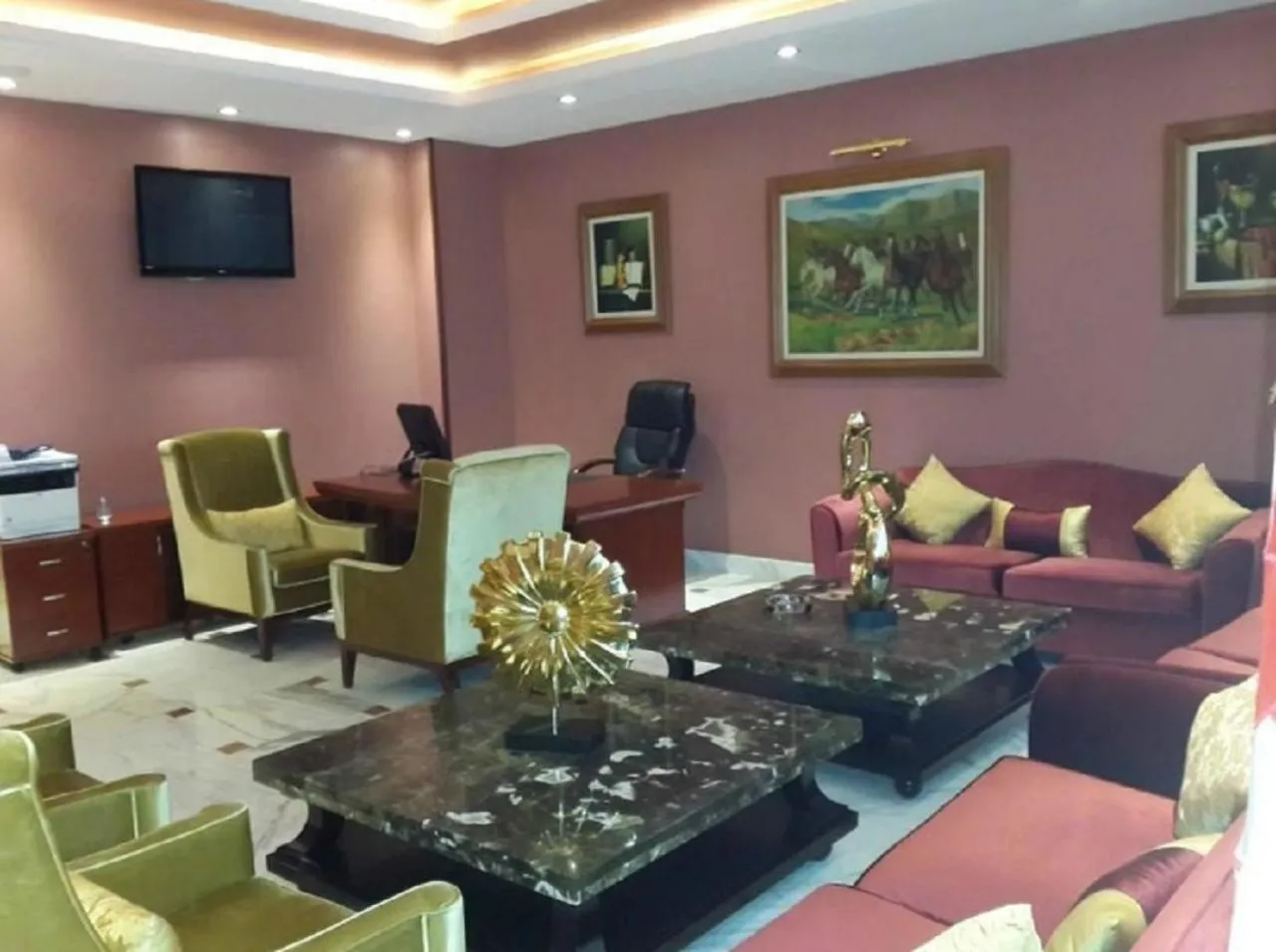 Communal lounge/ TV room in Oasis Hotel