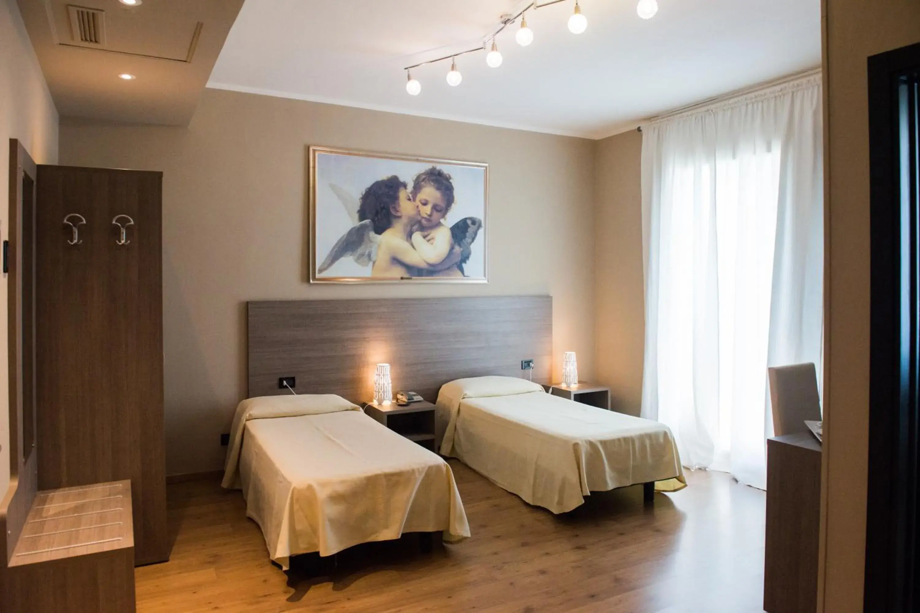 Triple Room in Albergo Grappolo D'oro Triple Room in Albergo Grappolo D'oro