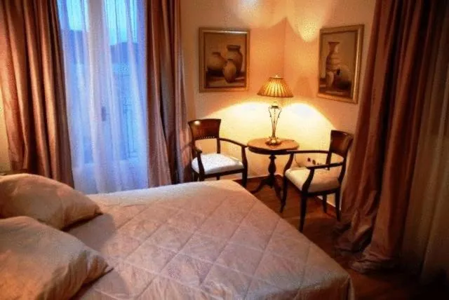 Bed in Korina Gallery Hotel