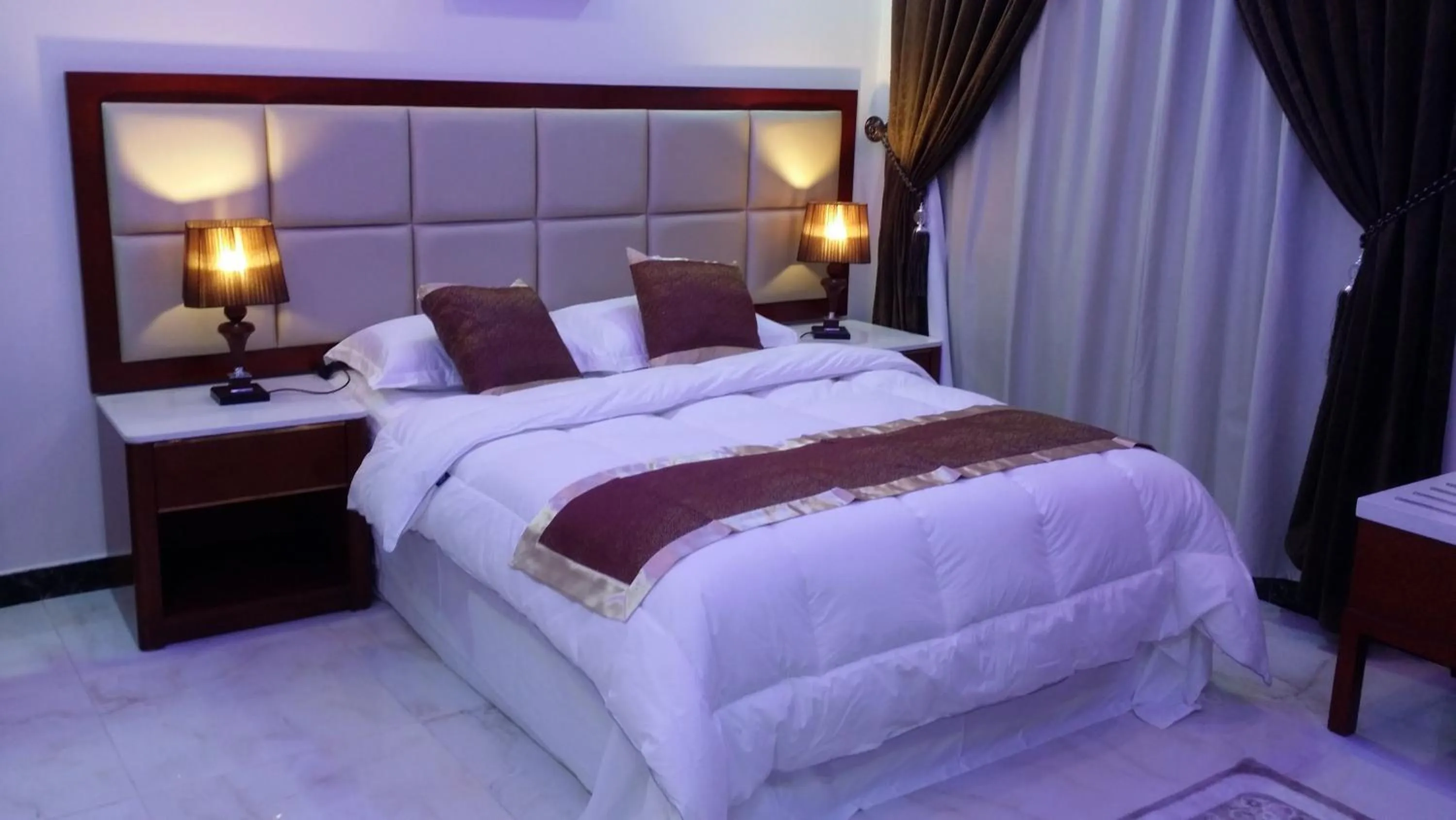 Bed in Ashbilia Suites