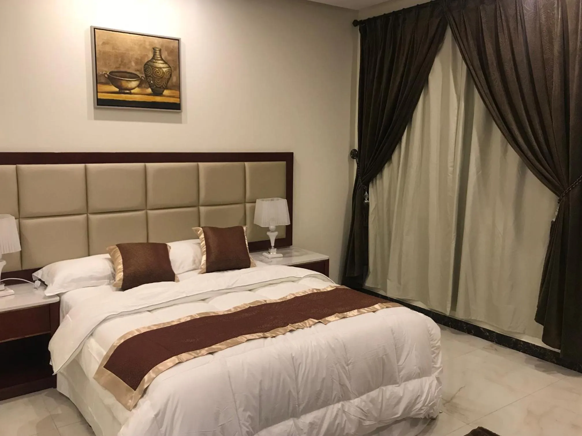 Bed in Ashbilia Suites
