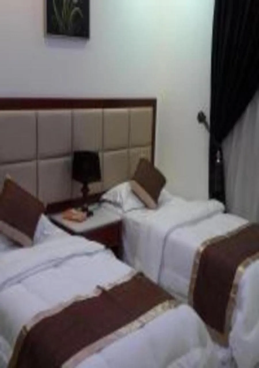 Bed in Ashbilia Suites