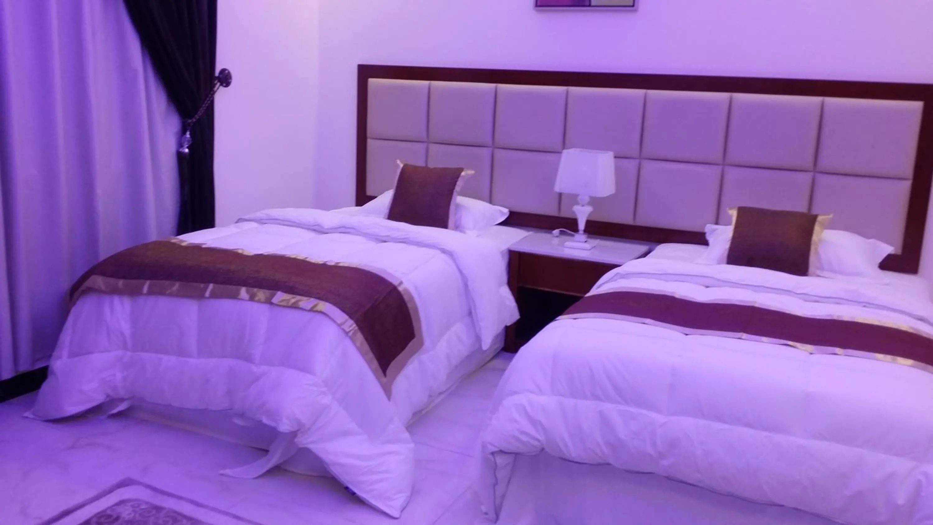 Bed in Ashbilia Suites