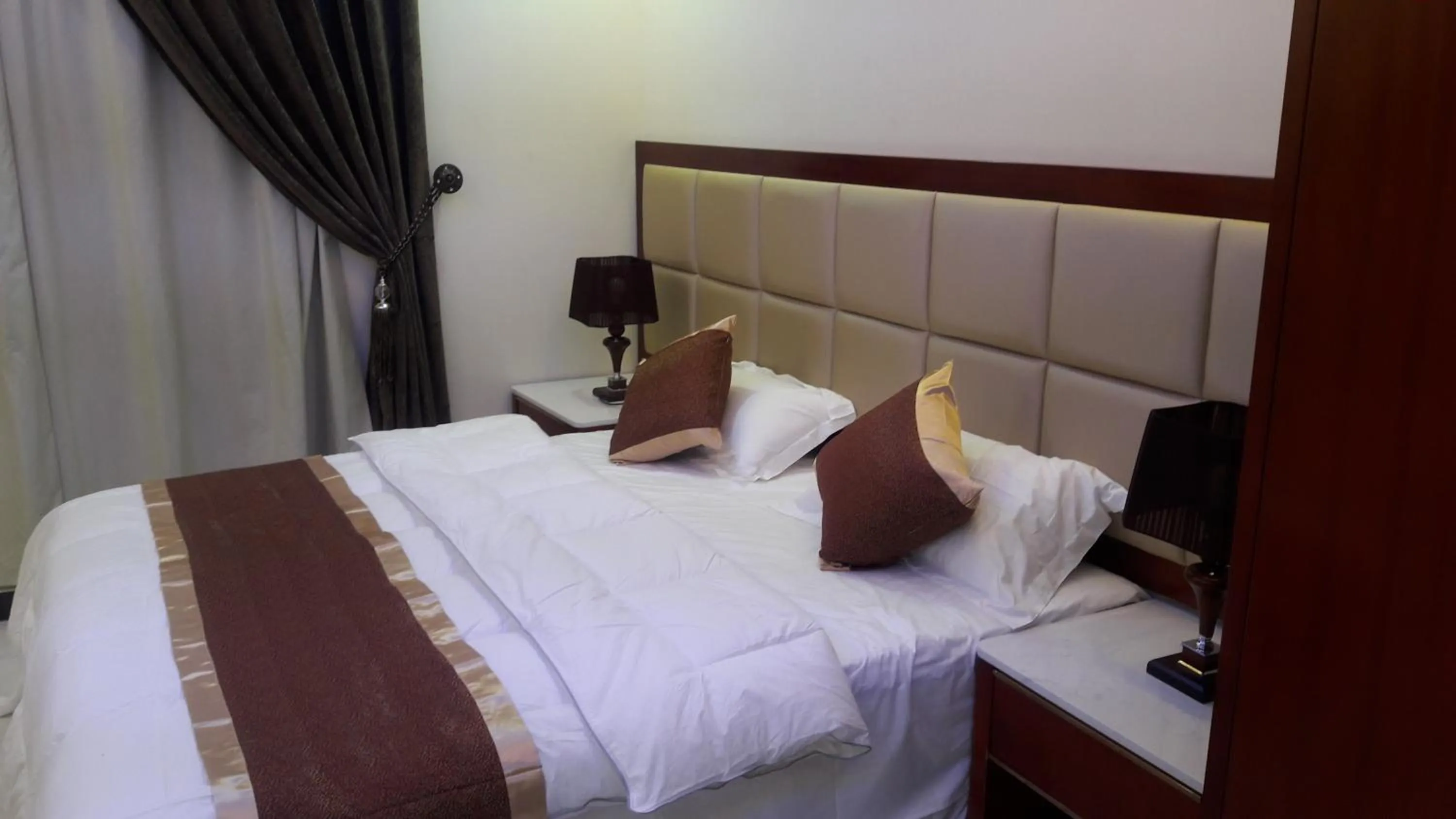 Bed in Ashbilia Suites