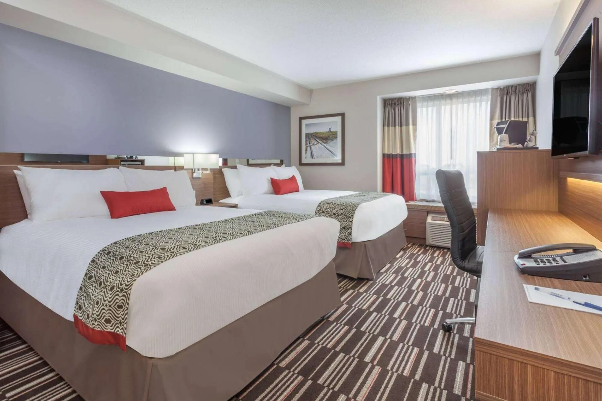 Bed in Microtel Inn & Suites by Wyndham Fort McMurray