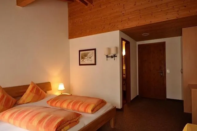 Photo of the whole room, Bed in Gasthaus Skiklub