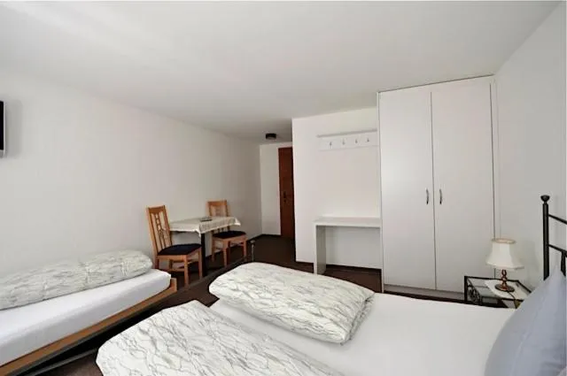 Photo of the whole room, Bed in Gasthaus Skiklub