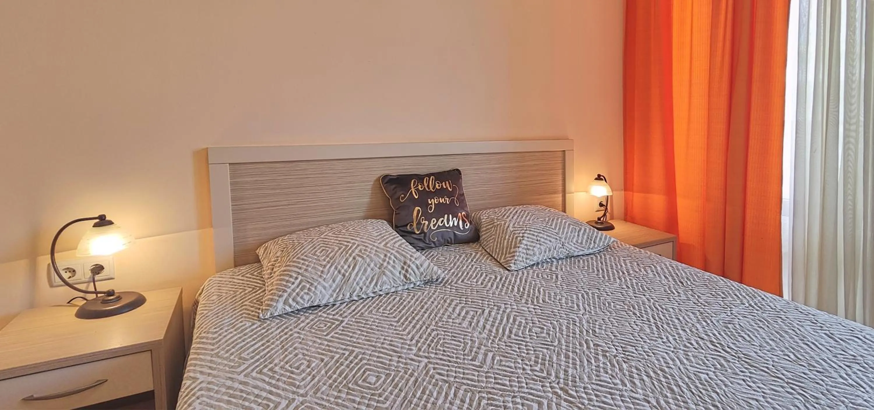 Bed in Royal Sun Apartments