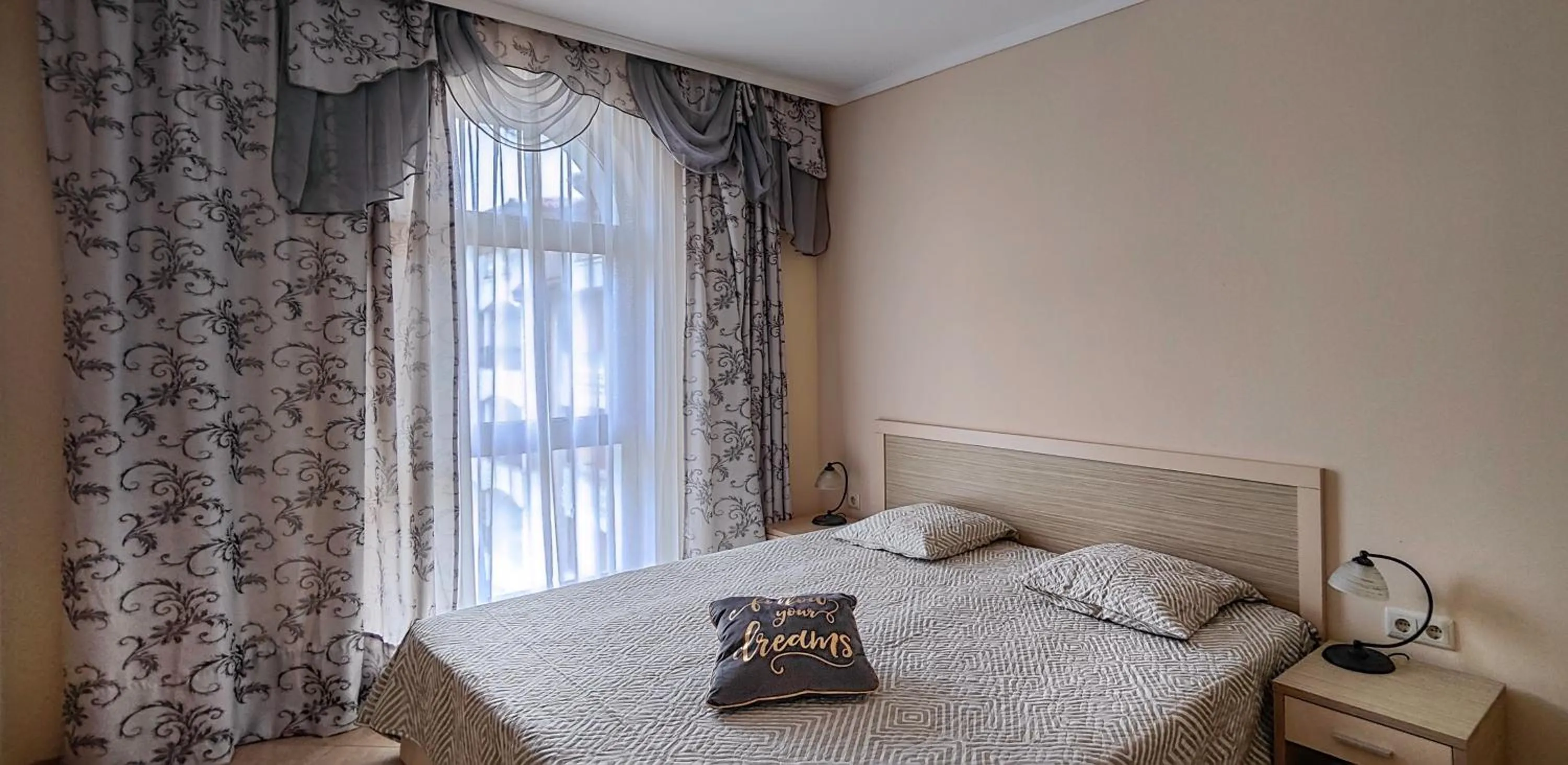 Bed in Royal Sun Apartments