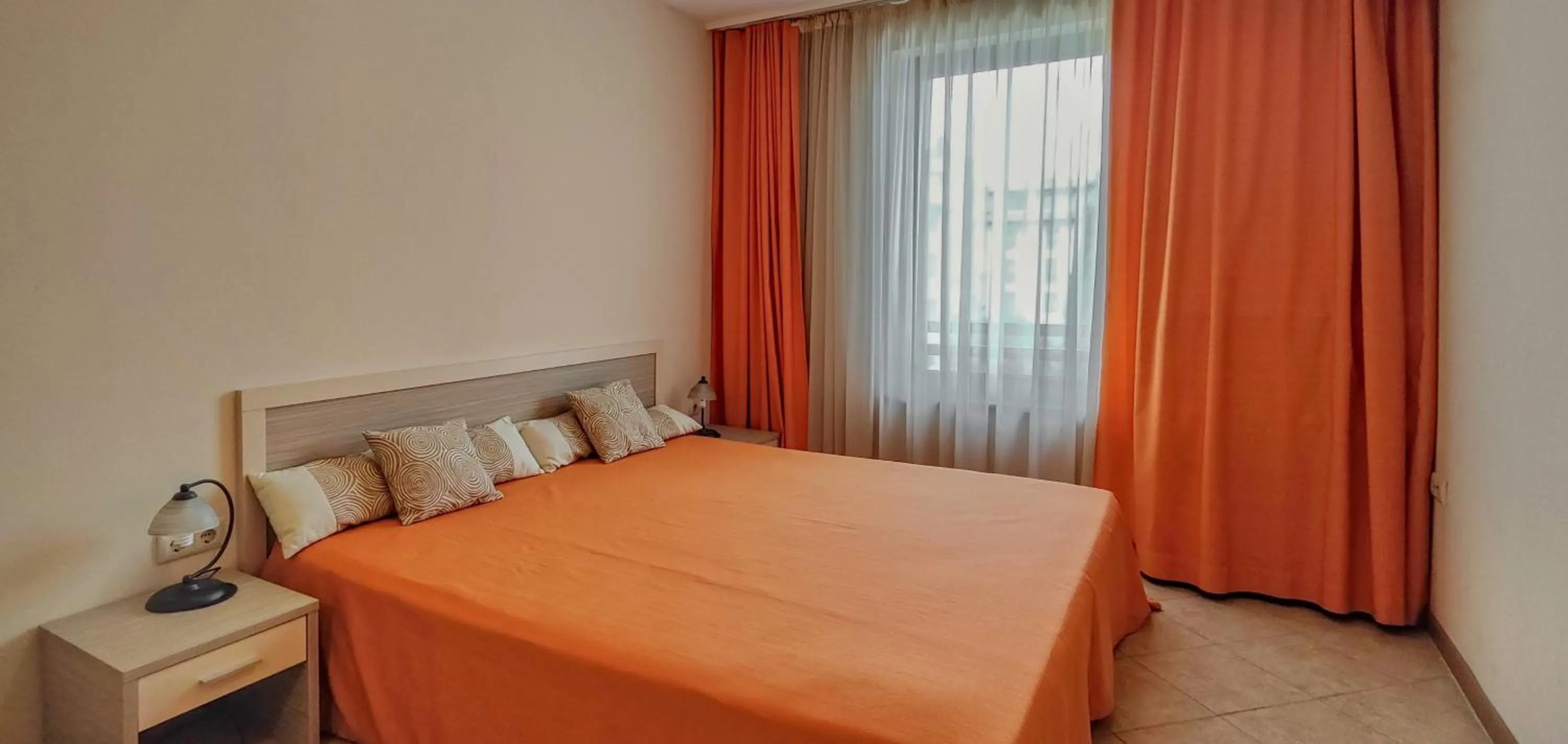 Bed in Royal Sun Apartments