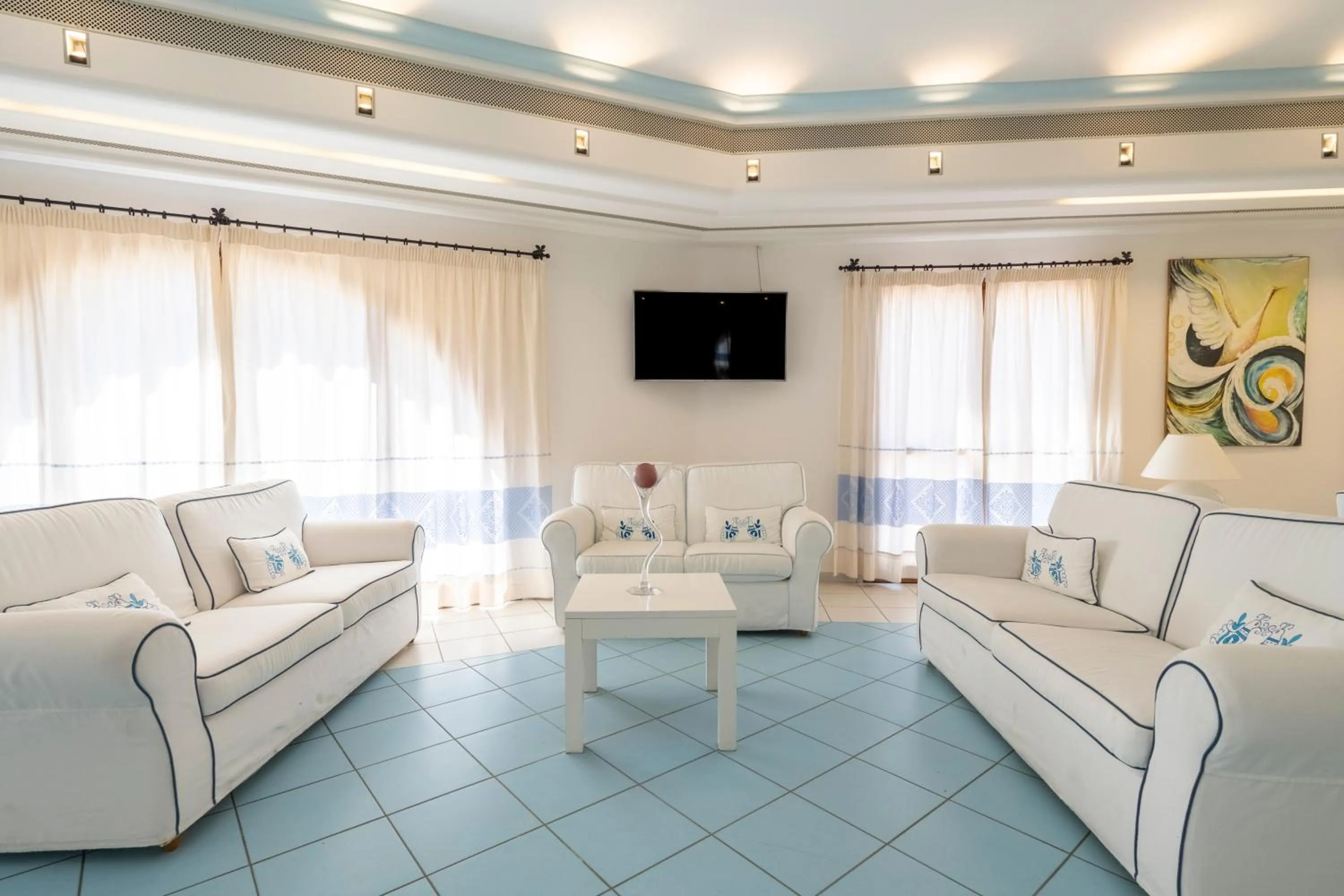 Communal lounge/ TV room in Cala Della Torre Resort