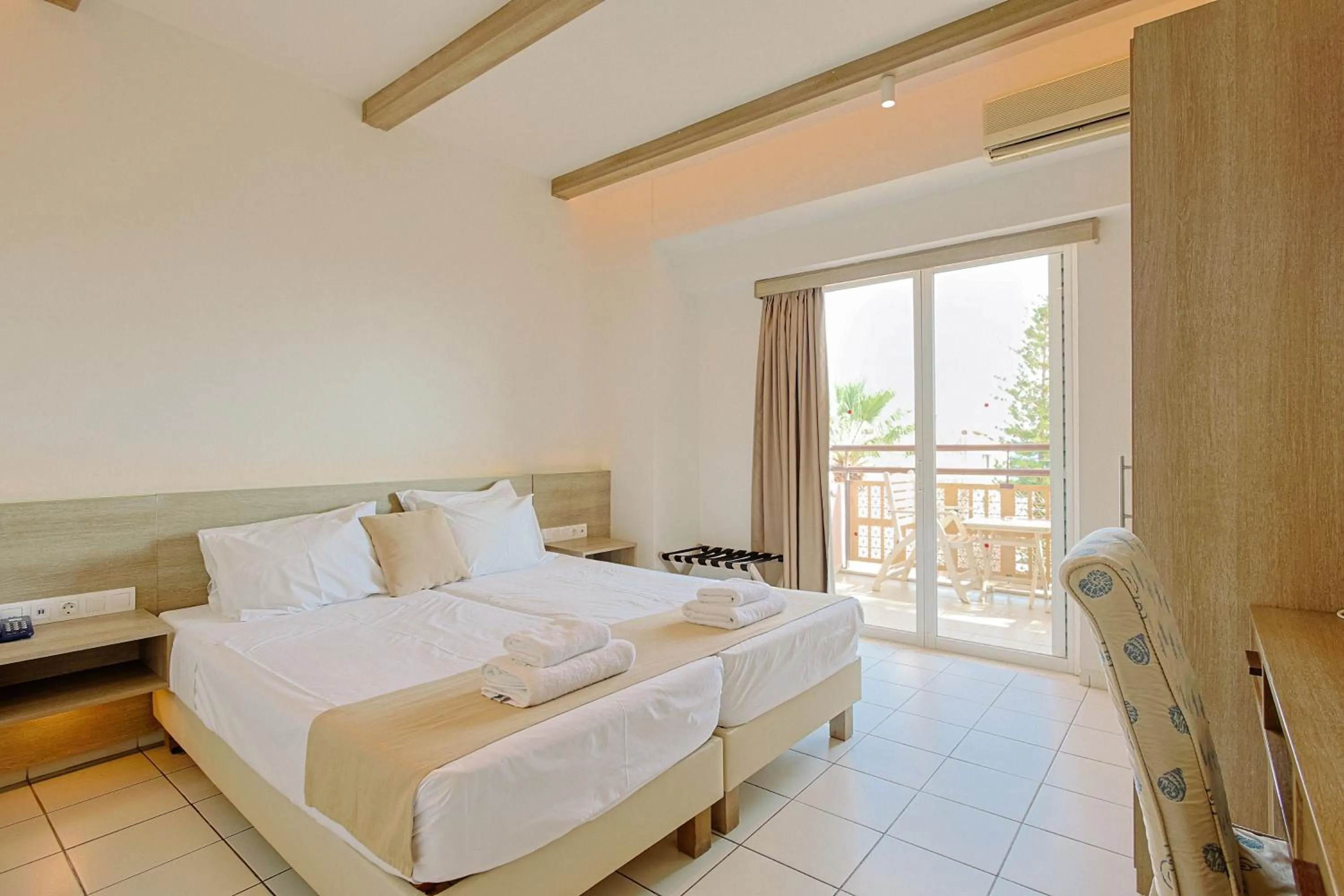 Bed in Porto Greco Village Beach Hotel