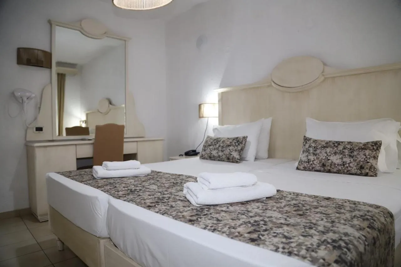 Bed in Porto Greco Village Beach Hotel