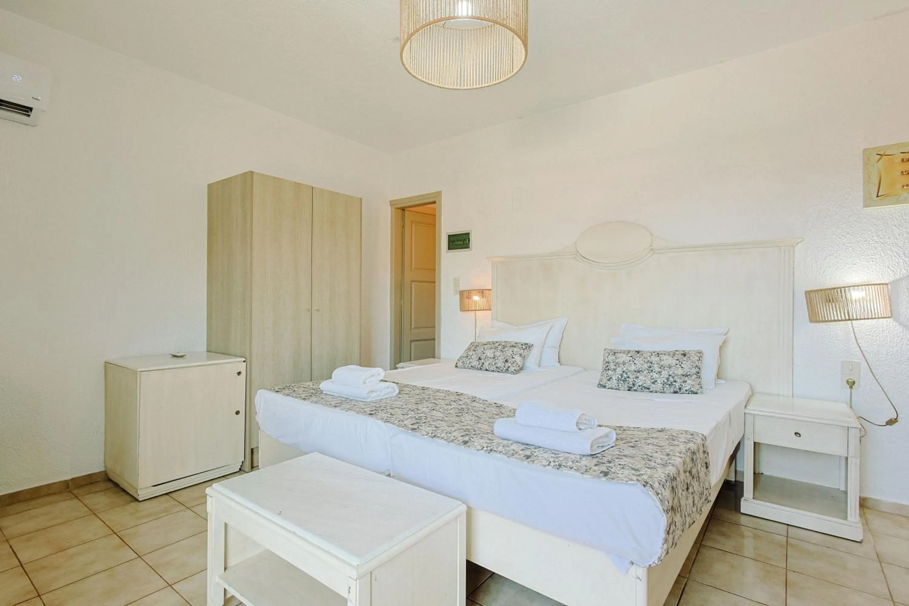 Bed in Porto Greco Village Beach Hotel