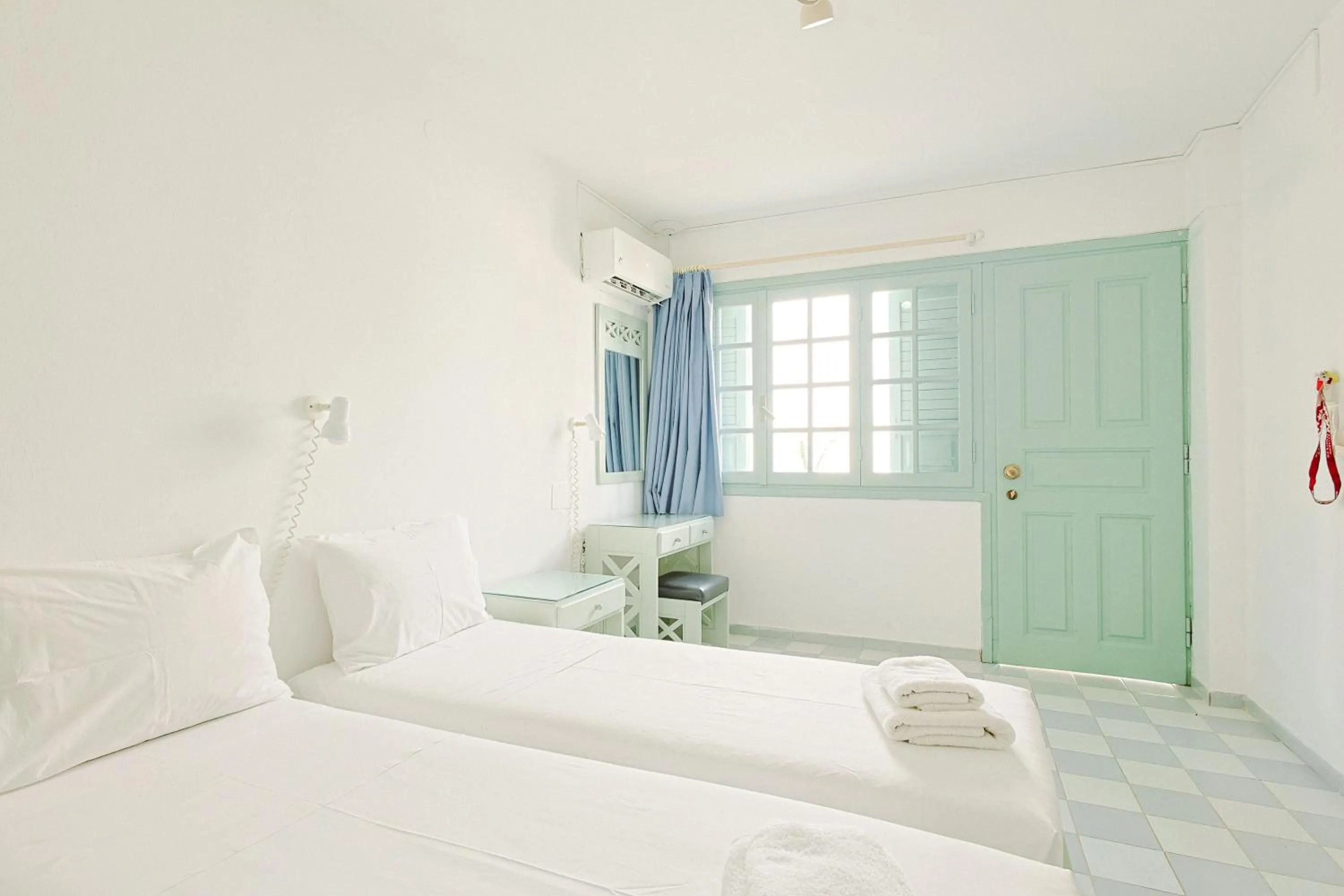 Bed in Porto Greco Village Beach Hotel