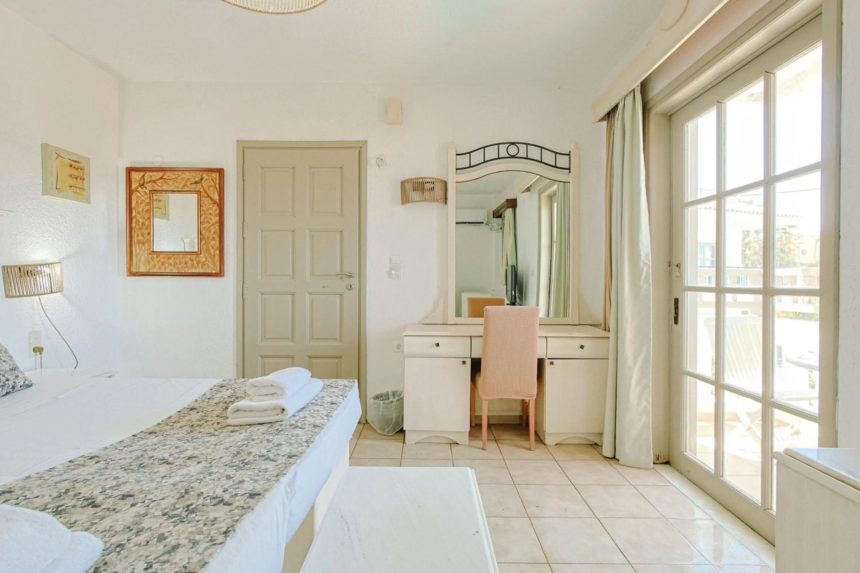 Bed in Porto Greco Village Beach Hotel