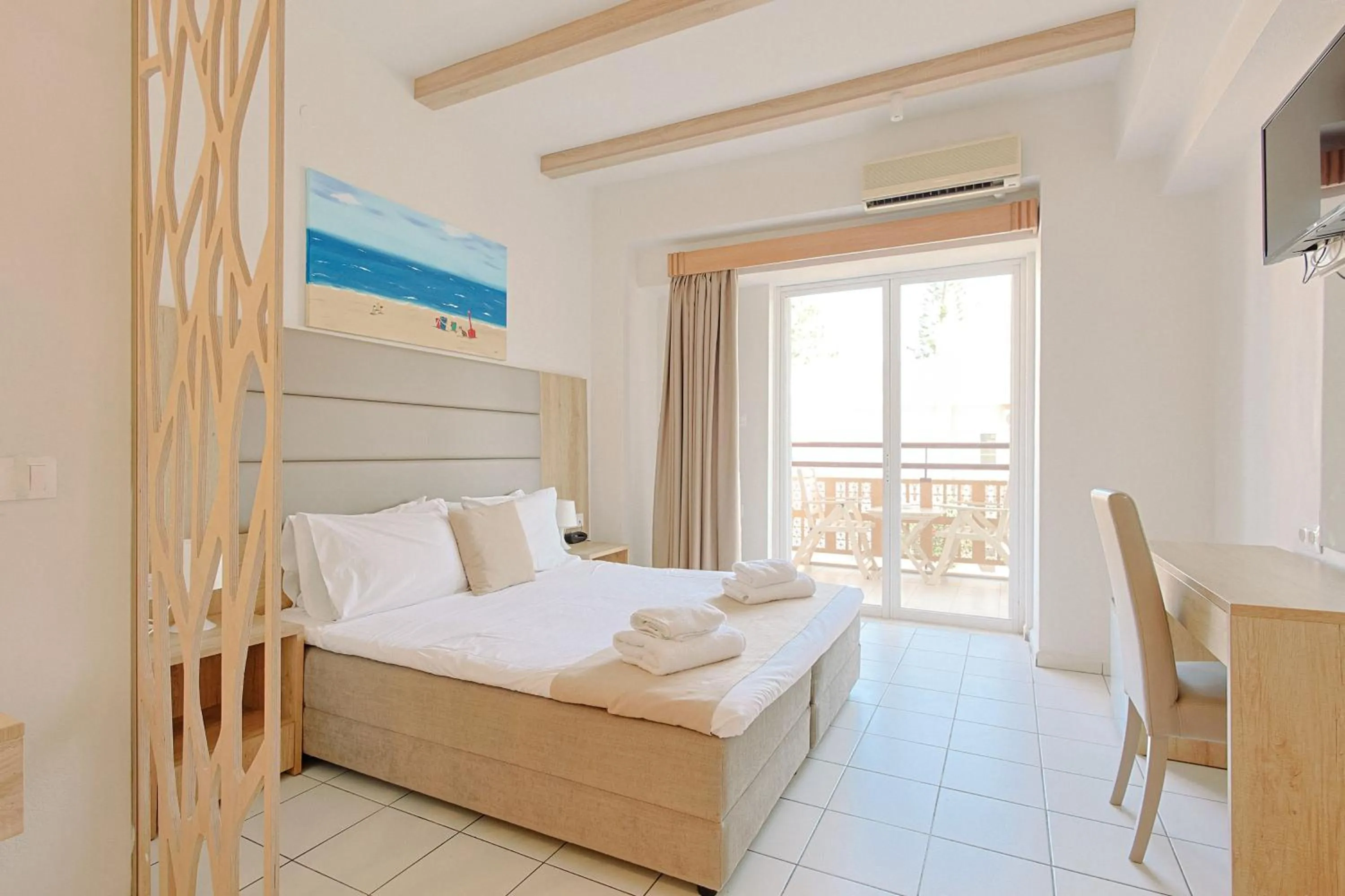 Bed in Porto Greco Village Beach Hotel