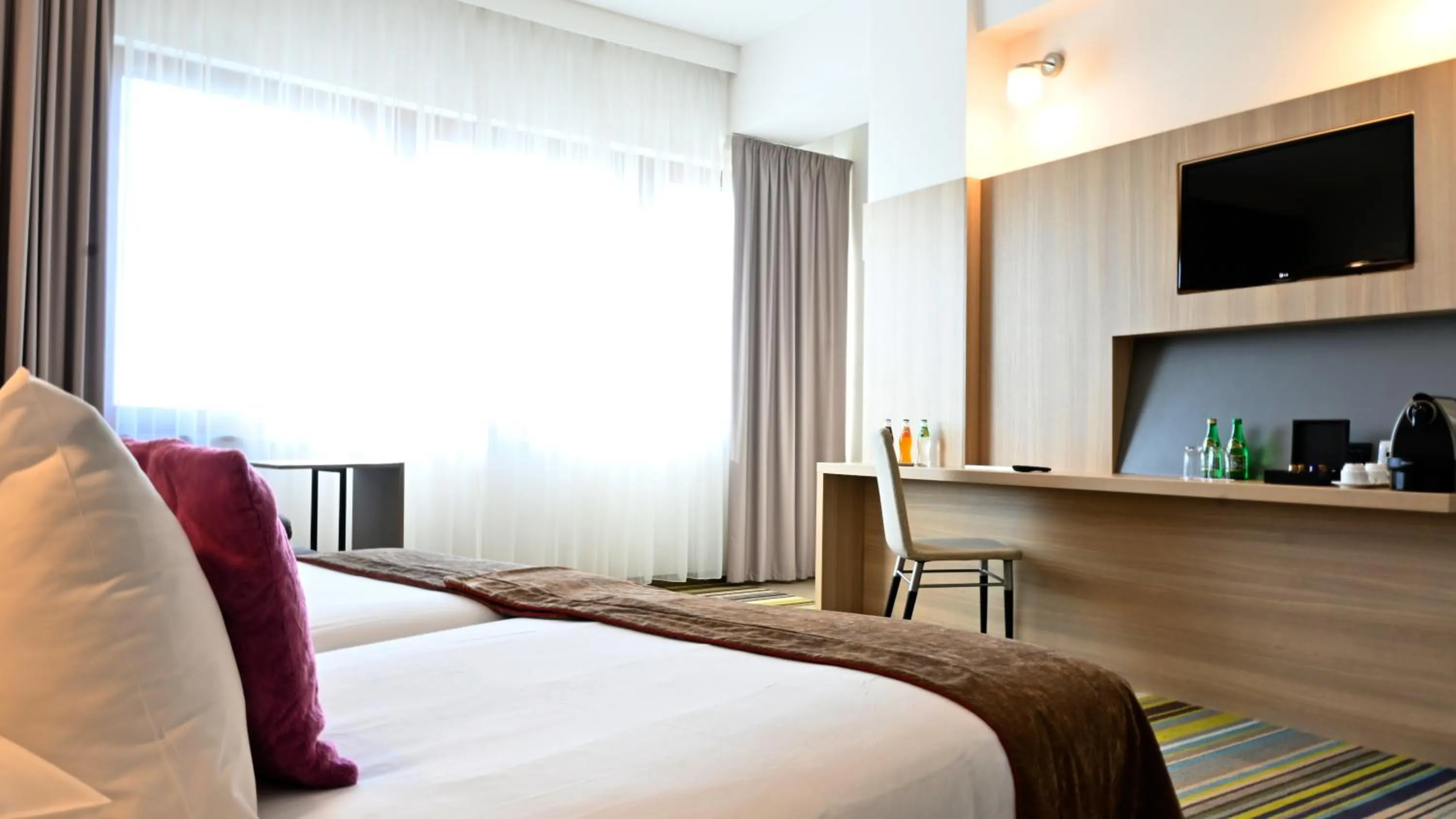 Seating area, Bed in Vestil Hotel