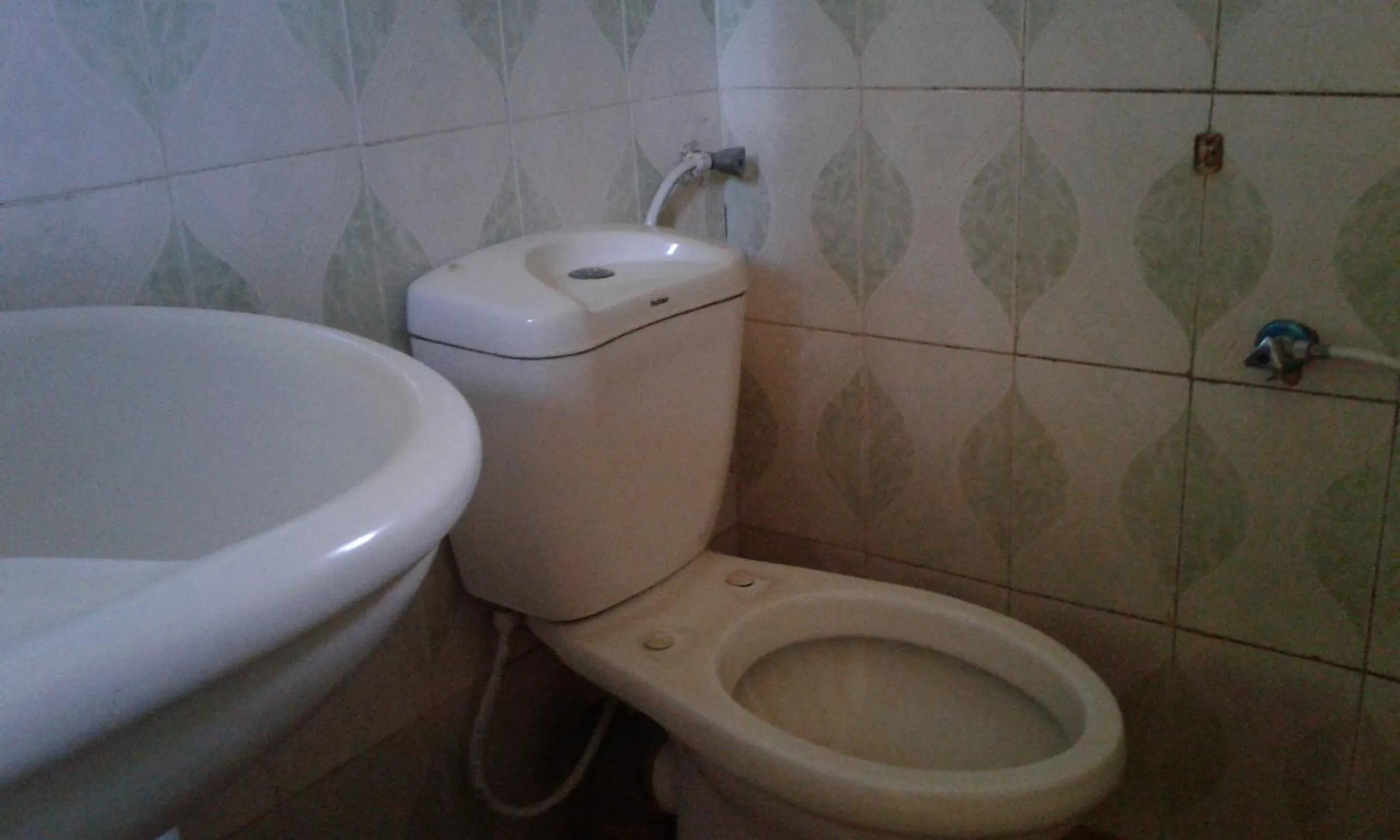 Toilet in JJ & JE Family House