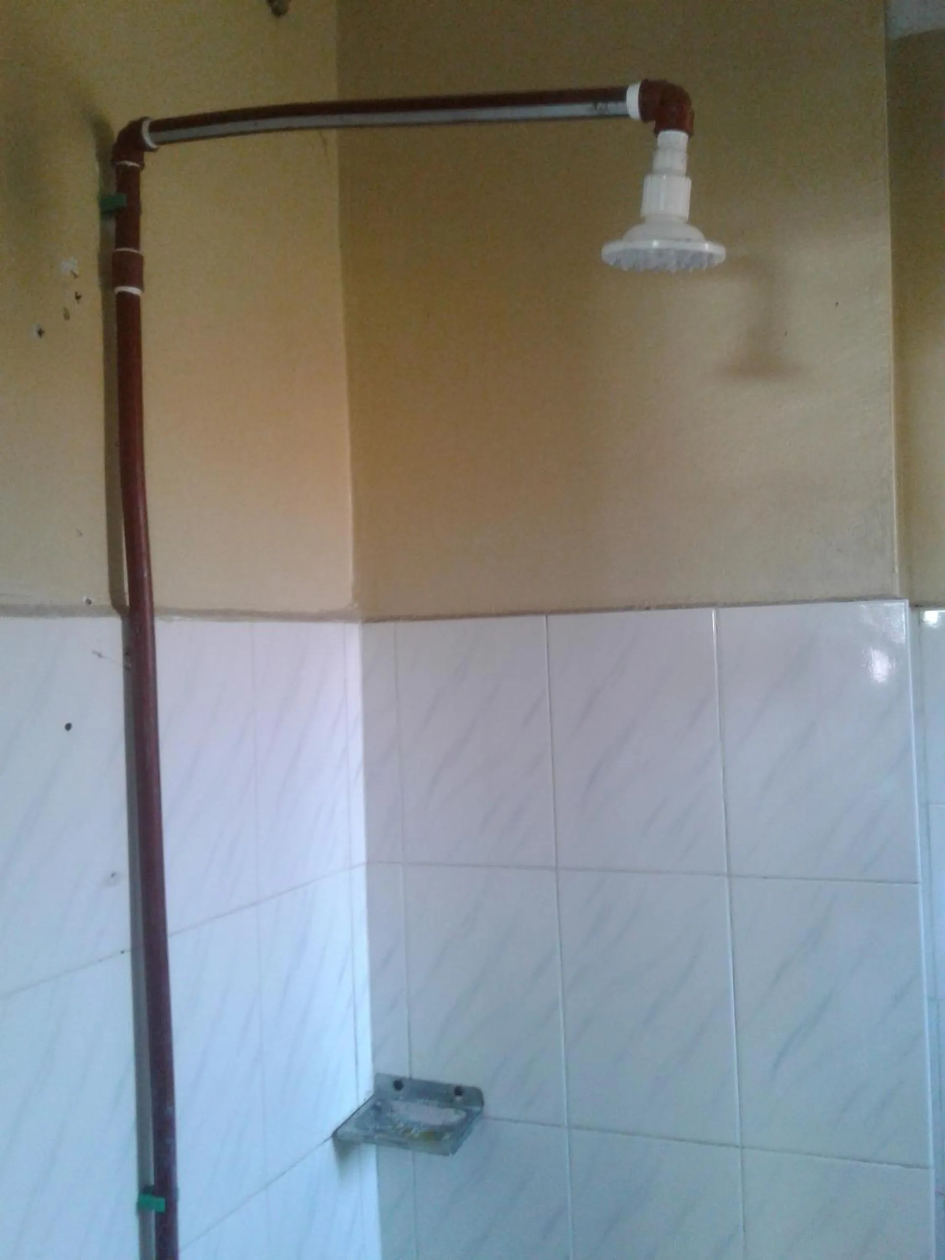 Shower in JJ & JE Family House