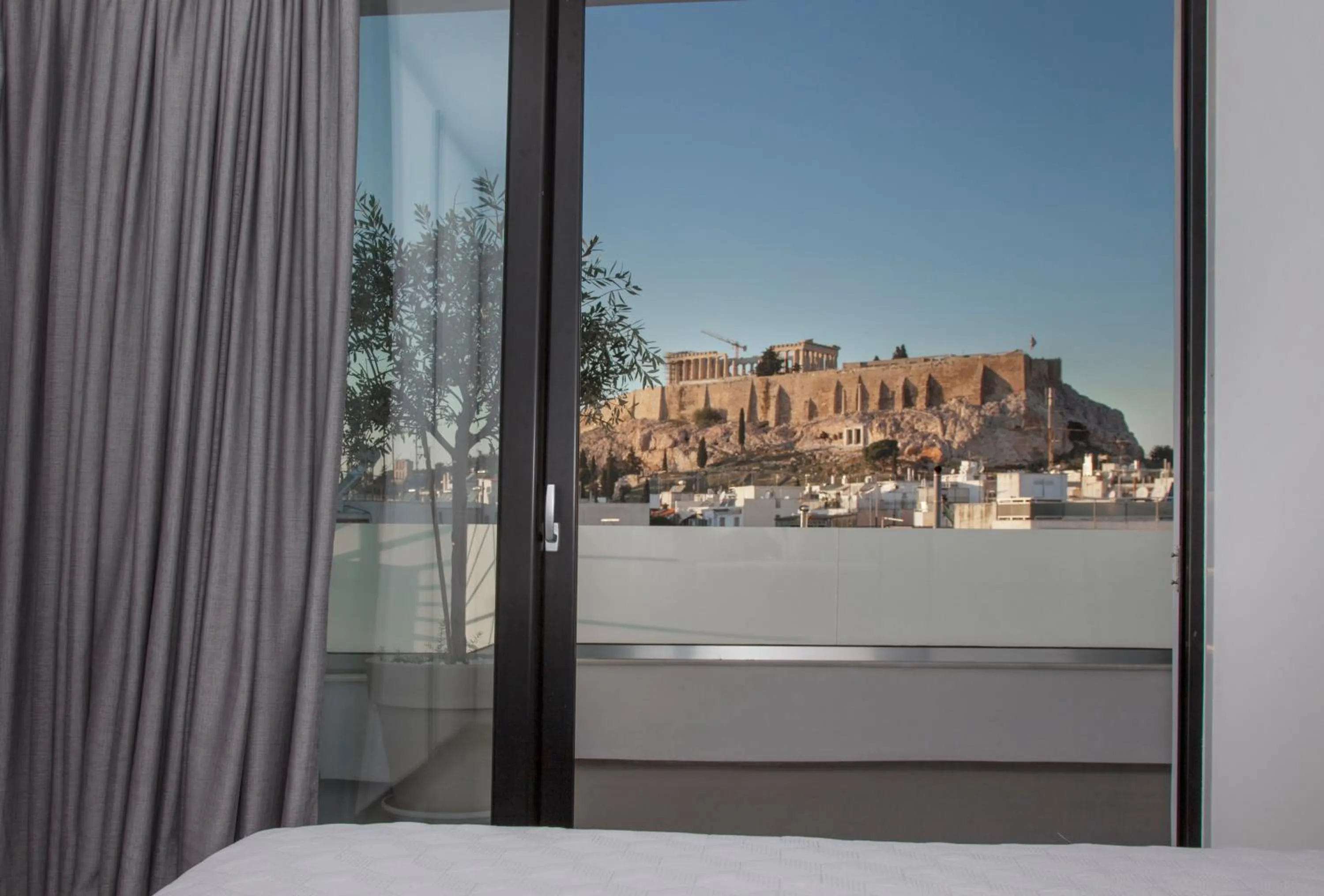 Bedroom in Luxury Penthouse touching the Acropolis by GHH