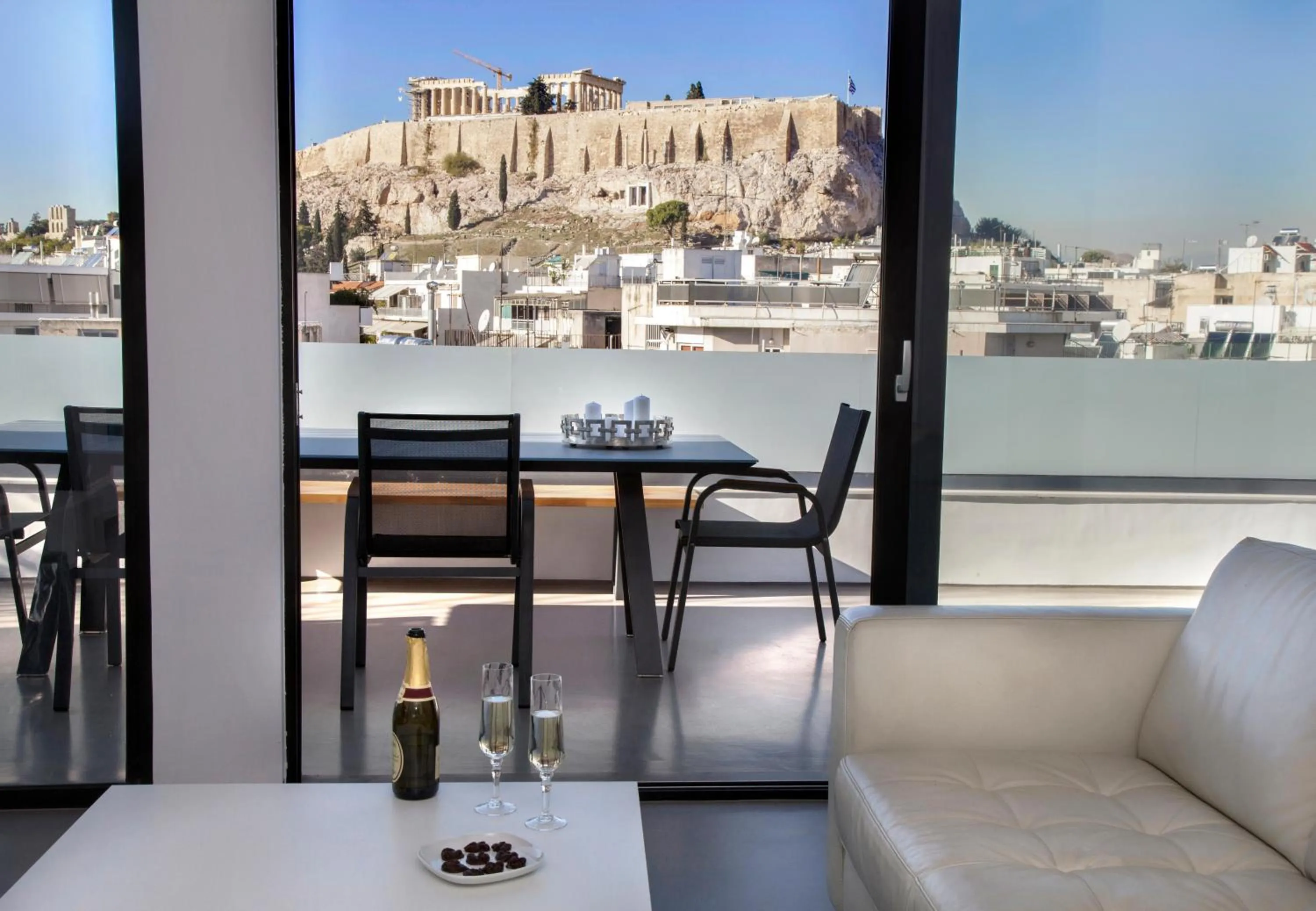 Living room in Luxury Penthouse touching the Acropolis by GHH