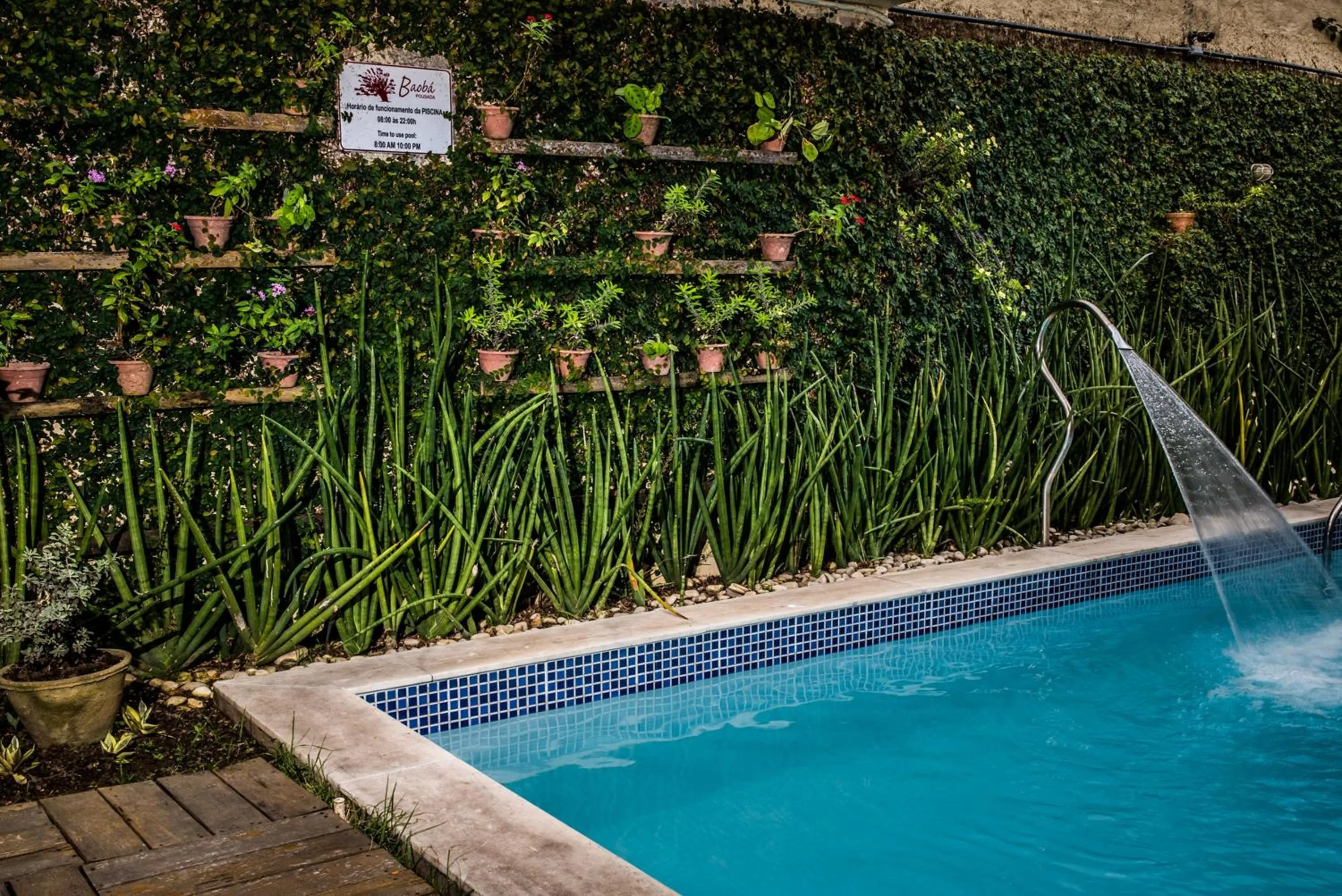 Swimming pool in Pousada Baobá e SPA