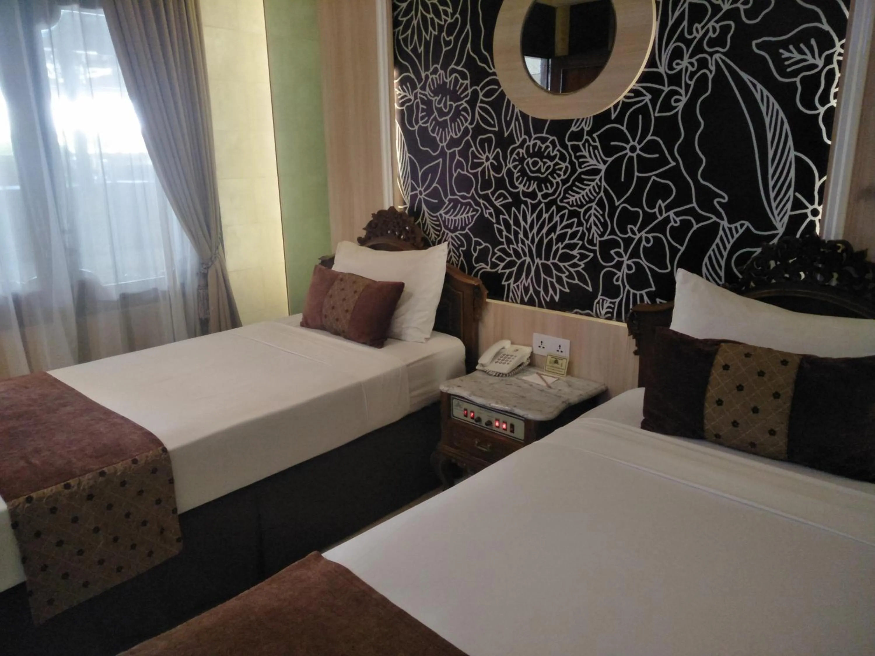 Bed in Hotel Indah Palace Yogyakarta