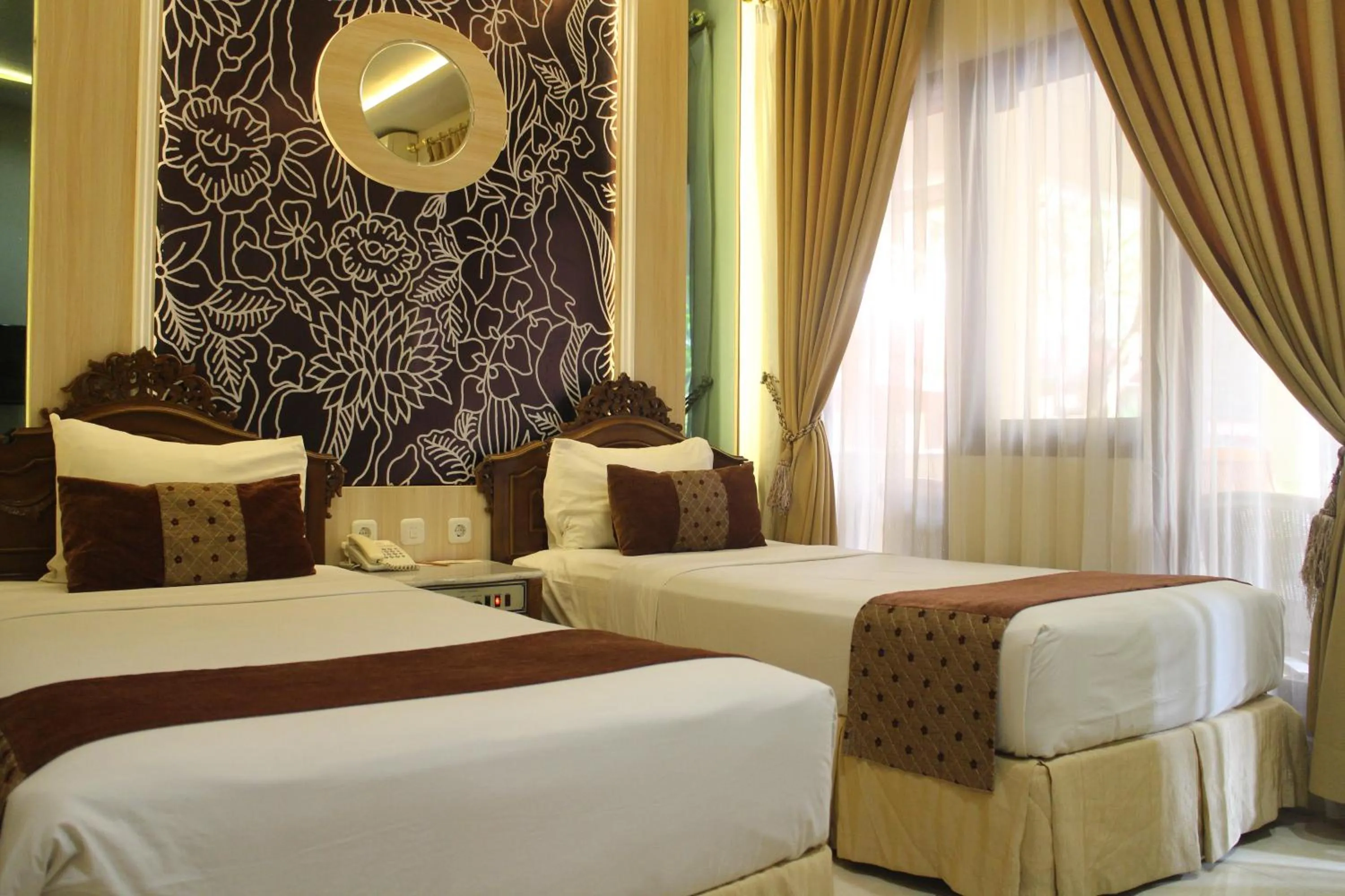 Bed in Hotel Indah Palace Yogyakarta