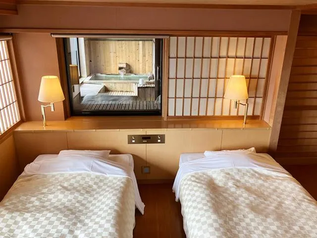Bed in Yunokawa Kanko Hotel Shoen